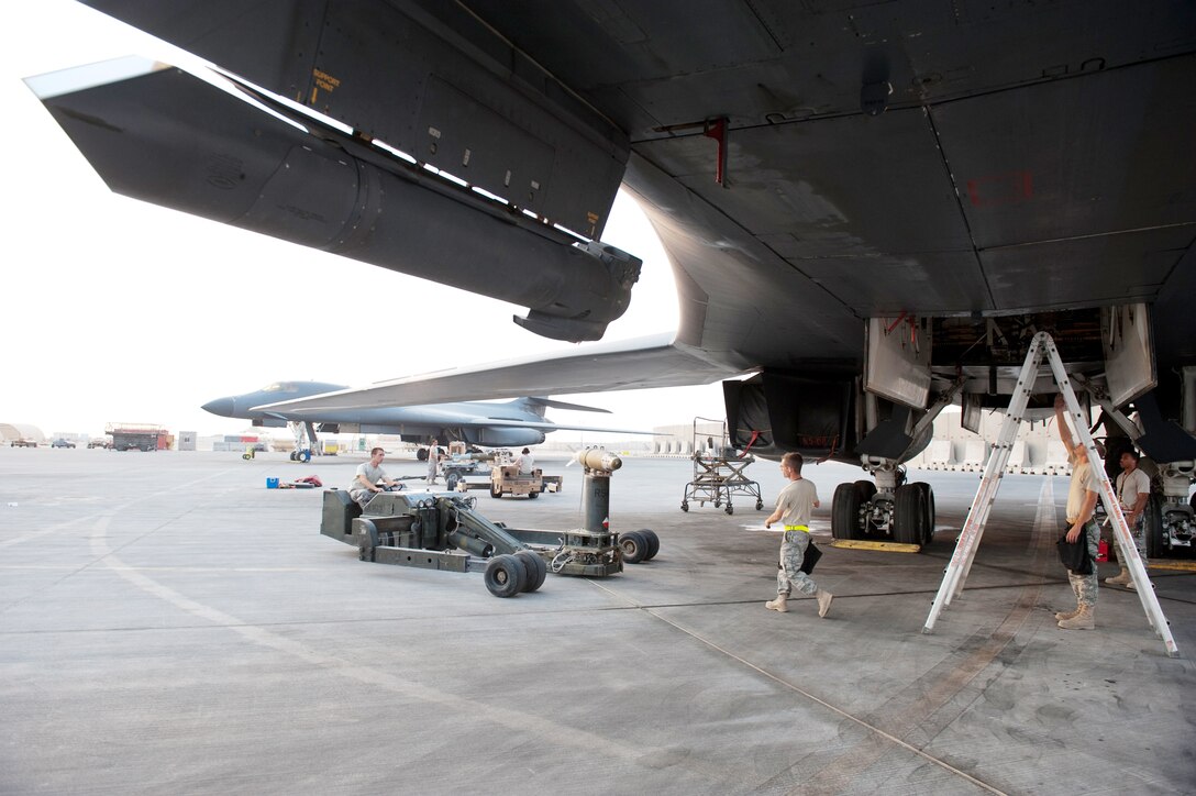 Airmen with the 37th Aircraft Maintenance Unit load GBU-38s onto a B-1B Lancer Nov. 11, 2009, at an air base in Southwest Asia. Carrying the largest payload of guided and unguided weapons in the Air Force inventory, the multi-mission B-1 is the backbone of America's long-range bomber force. The Airmen are deployed from Ellsworth Air Force Base, S.D., in support of operations Iraqi Freedom and Enduring Freedom. (U.S. Air Force photo/Staff Sgt. Robert Barney)