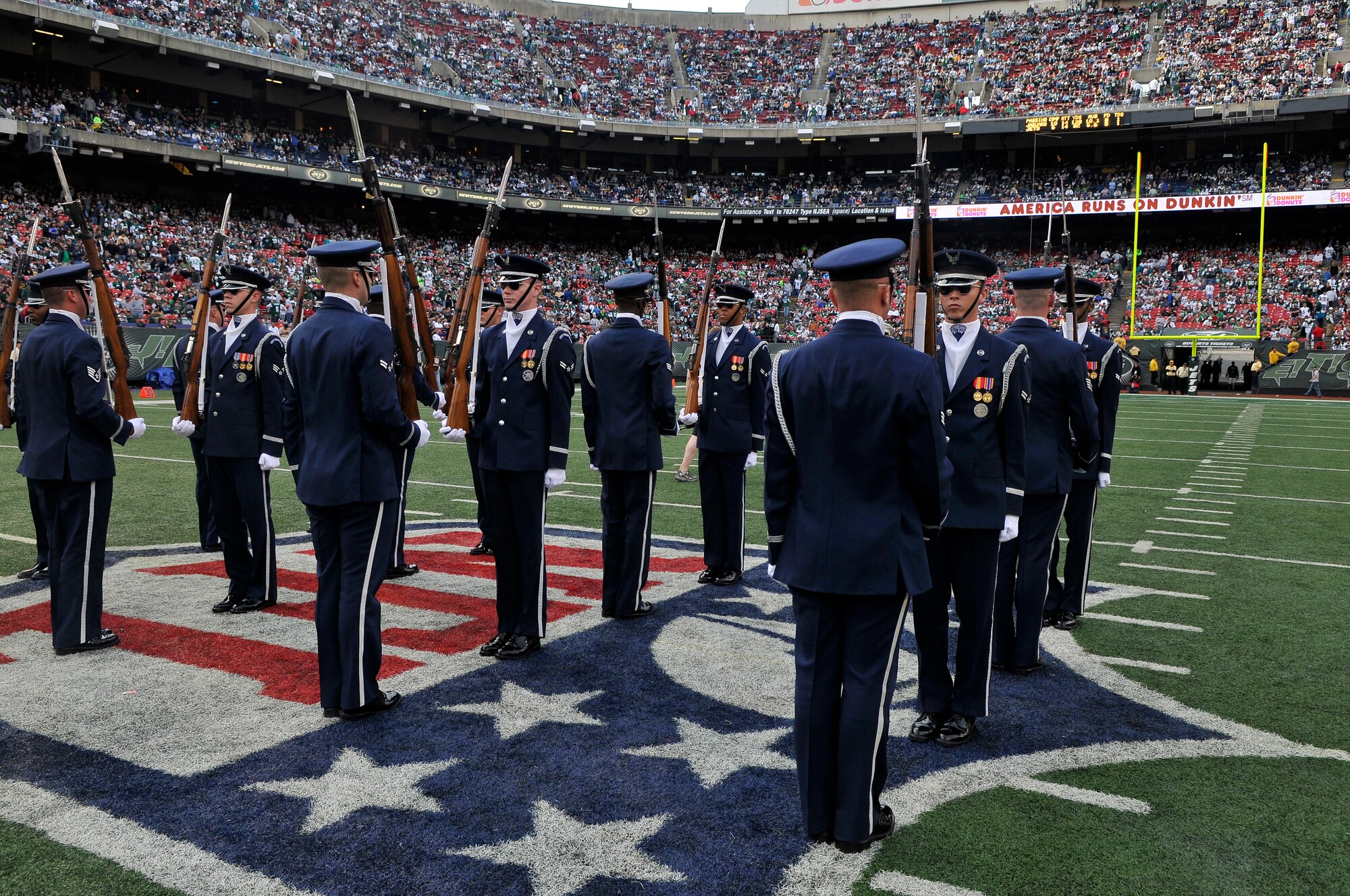 The United States Air Force Honor Guard Drill Team performs during the halftime show at a New York Jets football game against the Jacksonville Jaguars at Giants Stadium Nov. 15, in East Rutherford, New Jersey. The Drill Team tours worldwide as ‘Ambassadors in blue’ personifying the integrity, discipline, and teamwork of every Airman and every Air Force mission. During the Air Force Honor Guard's 60-year history, their traveling component, the Drill Team, has performed in every state of the union and many countries abroad. (U.S. Air Force photo/Senior Airman Marleah Miller)