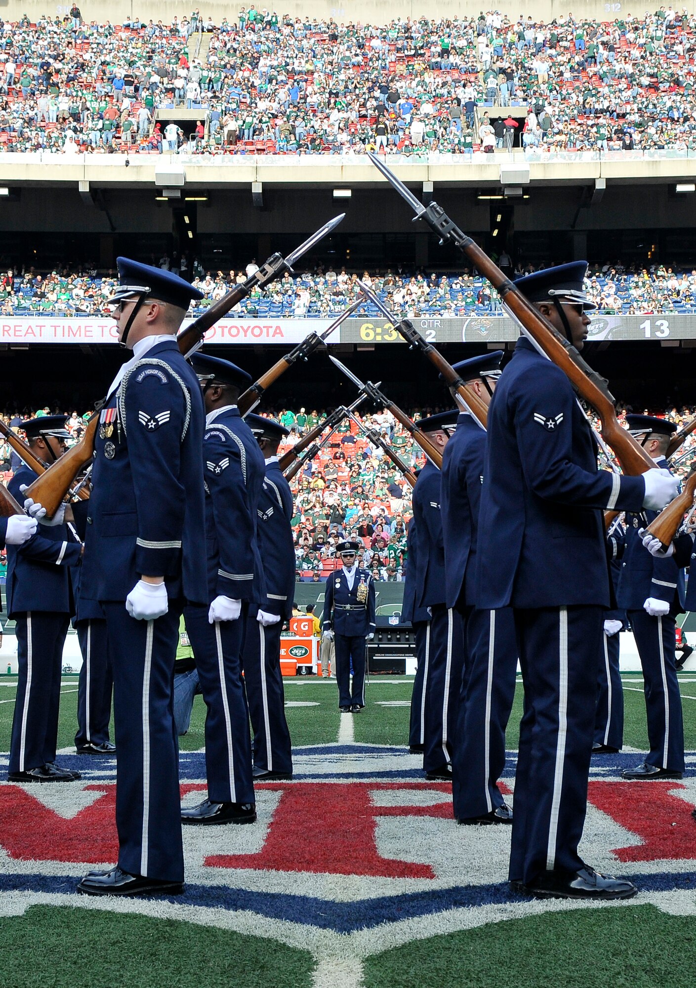 The United States Air Force Honor Guard Drill Team performs during the halftime show at a New York Jets football game against the Jacksonville Jaguars at Giants Stadium Nov. 15, in East Rutherford, New Jersey. The Drill Team tours worldwide to showcase the discipline and professionalism necessary to be a United States Air Force Airman. During the Air Force Honor Guard's 60-year history, their traveling component, the Drill Team, has performed in every state of the union and many countries abroad. (U.S. Air Force photo/Senior Airman Marleah Miller)