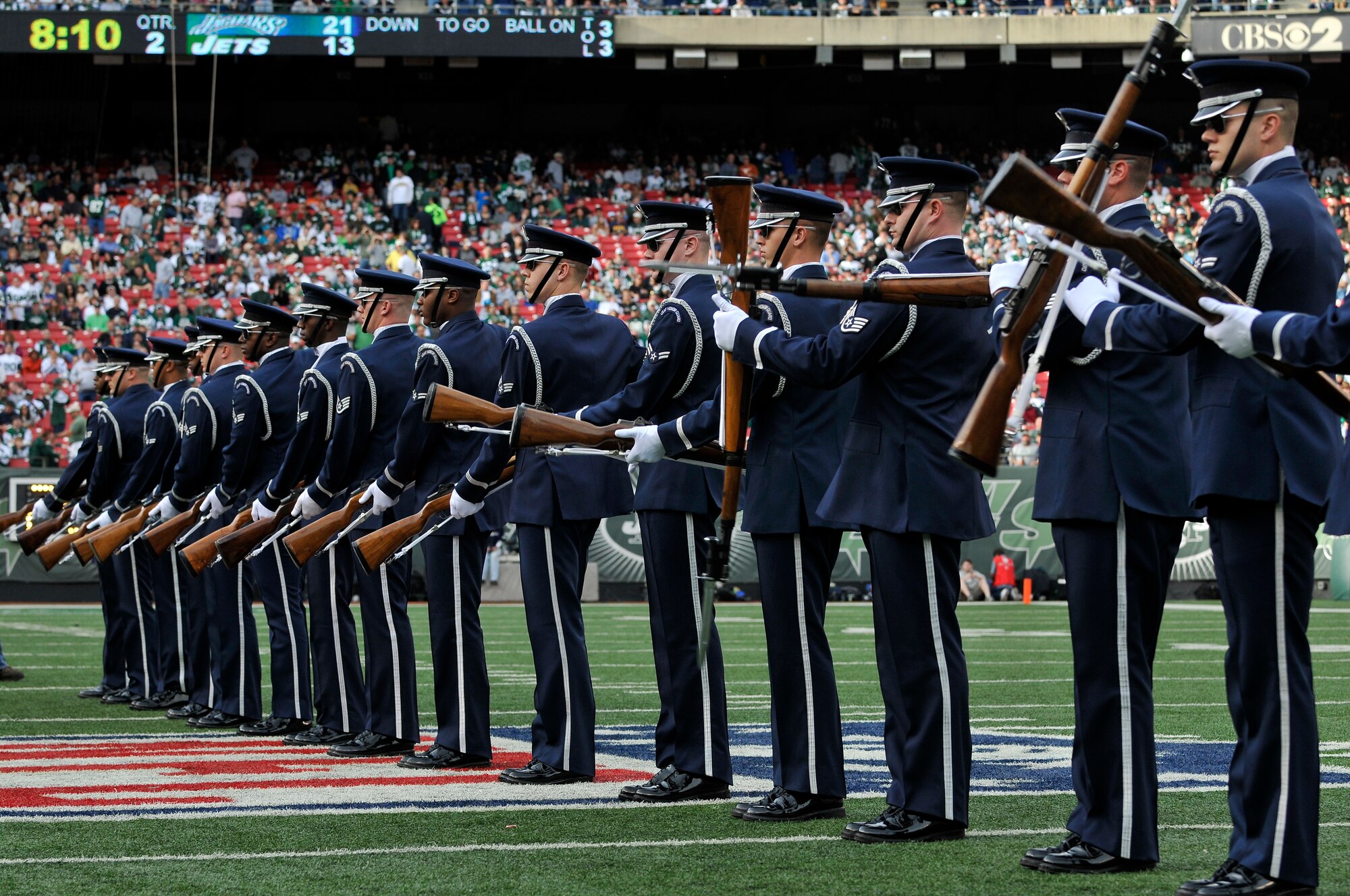 United States Air Force Honor Guard Drill Team members perform their line formation during the halftime show at a New York Jets football game against the Jacksonville Jaguars at Giants Stadium Nov. 15, in East Rutherford, New Jersey. The Drill Team tours worldwide to showcase the discipline and teamwork of every Air Force Airman. During the Air Force Honor Guard's 60-year history, their traveling component, the Drill Team, has performed in every state of the union and many countries abroad. (U.S. Air Force photo/Senior Airman Marleah Miller)