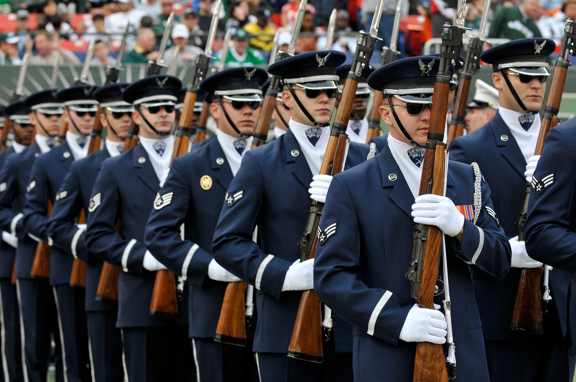 The United States Air Force Honor Guard Drill Team marches onto the field to perform during the halftime show at a New York Jets football game against the Jacksonville Jaguars at Giants Stadium Nov. 15, in East Rutherford, New Jersey. The Drill Team tours worldwide representing all Airmen while showcasing Air Force precision and professionalism. During the Air Force Honor Guard's 60-year history, their traveling component, the Drill Team, has performed in every state of the union and many countries abroad. (U.S. Air Force photo/Senior Airman Marleah Miller)