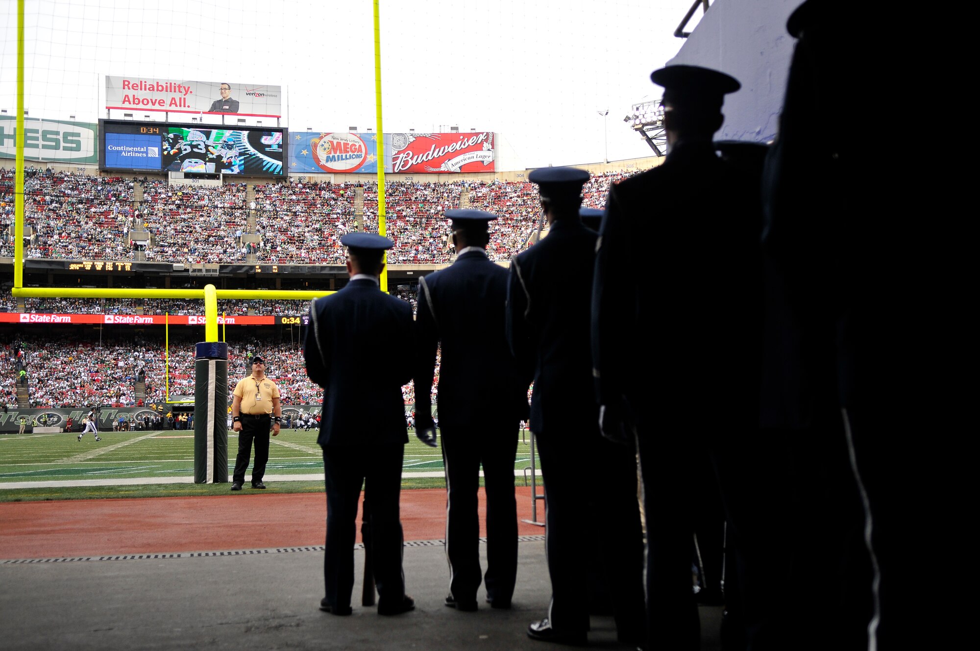The United States Air Force Honor Guard Drill Team prepares to take the field to perform during the halftime show at a New York Jets football game against the Jacksonville Jaguars at Giants Stadium Nov. 15, in East Rutherford, New Jersey. The Drill Team tours worldwide representing all Airmen while showcasing Air Force precision and professionalism. During the Air Force Honor Guard's 60-year history, their traveling component, the Drill Team, has performed in every state of the union and many countries abroad. (U.S. Air Force photo/Senior Airman Marleah Miller)