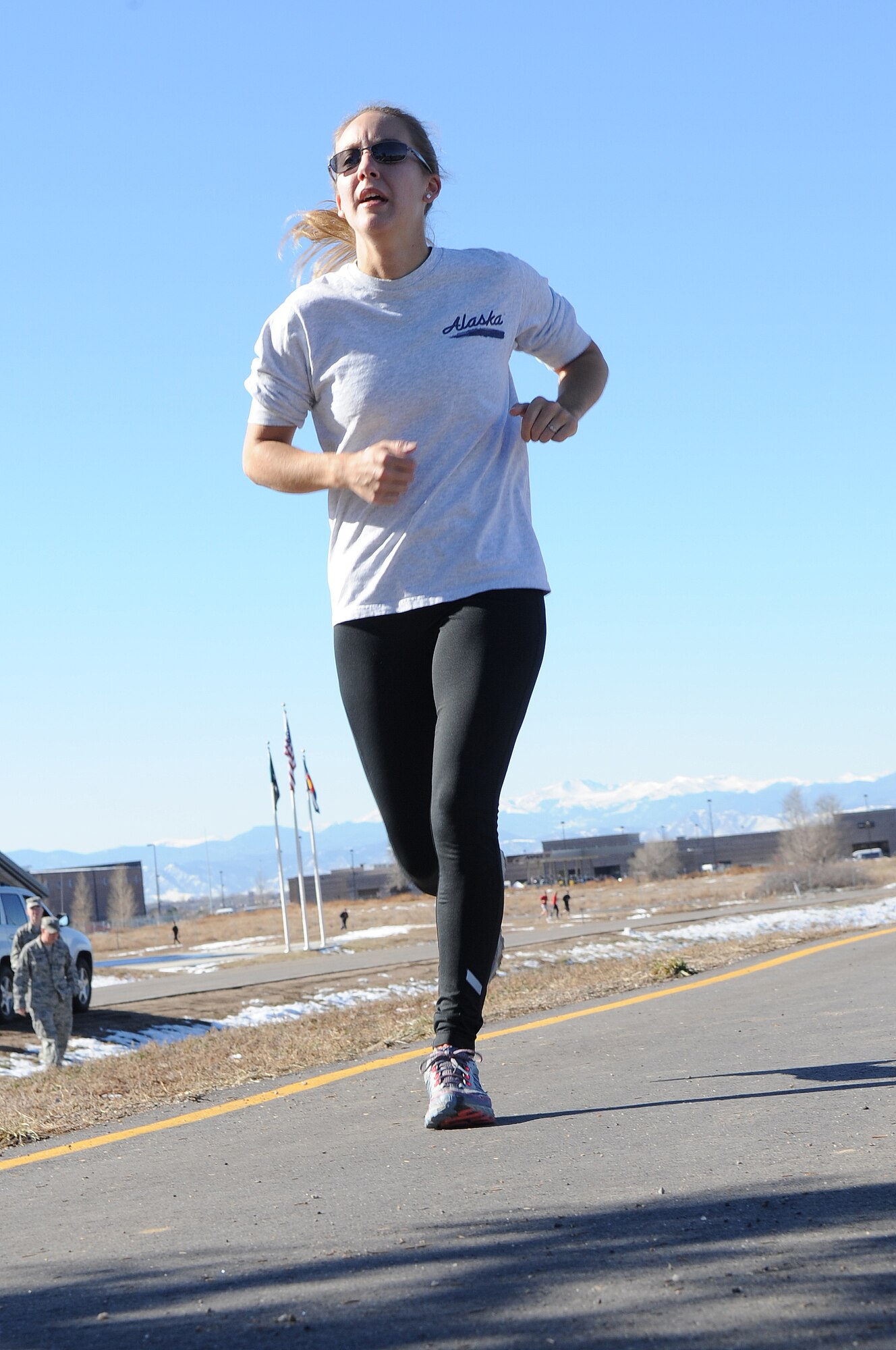 BUCKLEY AIR FORCE BASE, Colo. -- Staff Sgt. Lauren Twigg hurries toward the finish line during the Turkey Trot Nov. 18. First-place winners in the trot were awarded a free turkey. (U.S. Air Force photo by Airman First Class Marcy Glass)