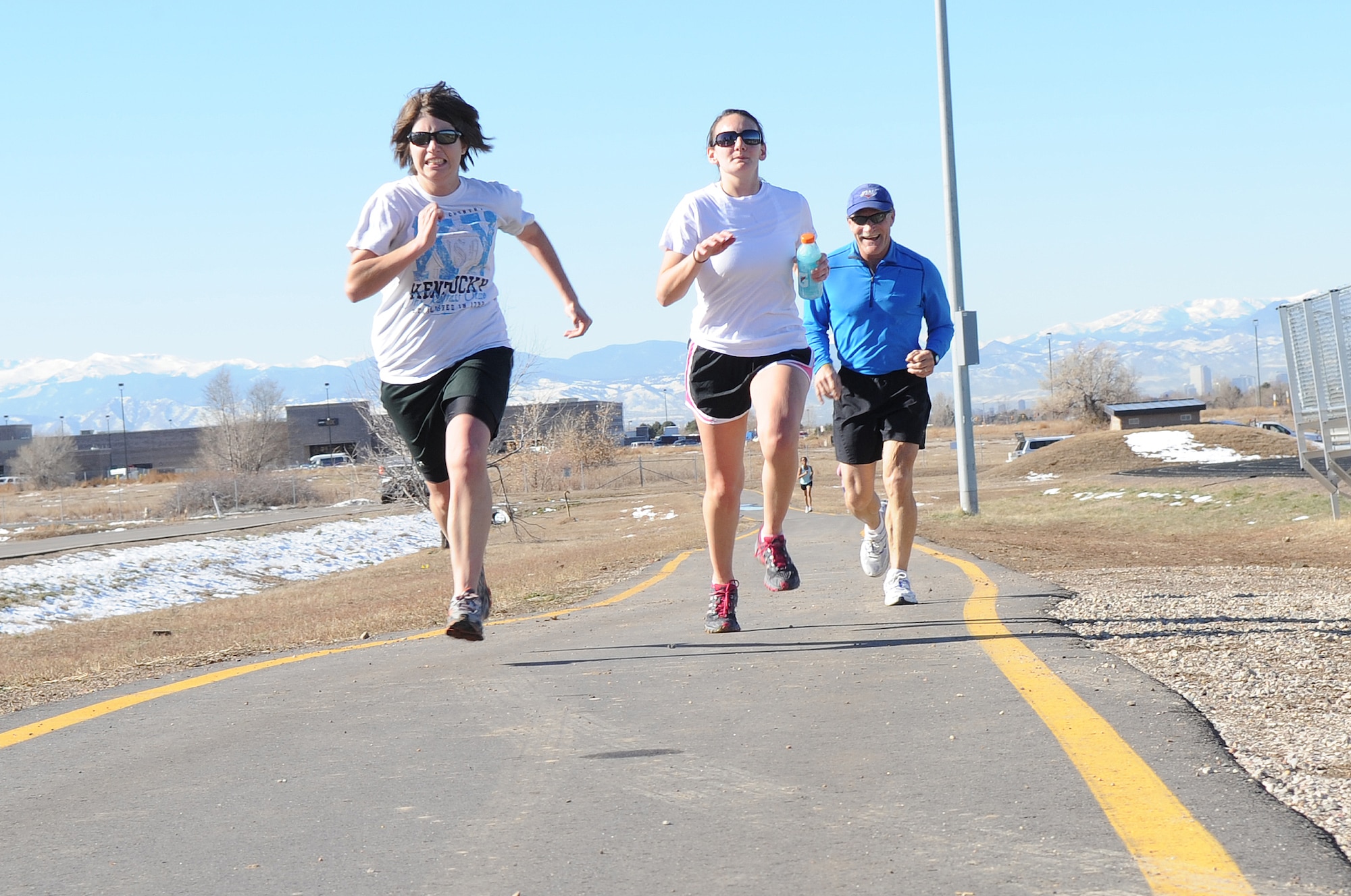 BUCKLEY AIR FORCE BASE, Colo. -- Team Buckley runners speed toward the finish line during the annual Turkey Trot Nov. 18. The Turkey Trot promotes fitness and camraderie during the holiday season. (U.S. Air Force photo by Airman First Class Marcy Glass)