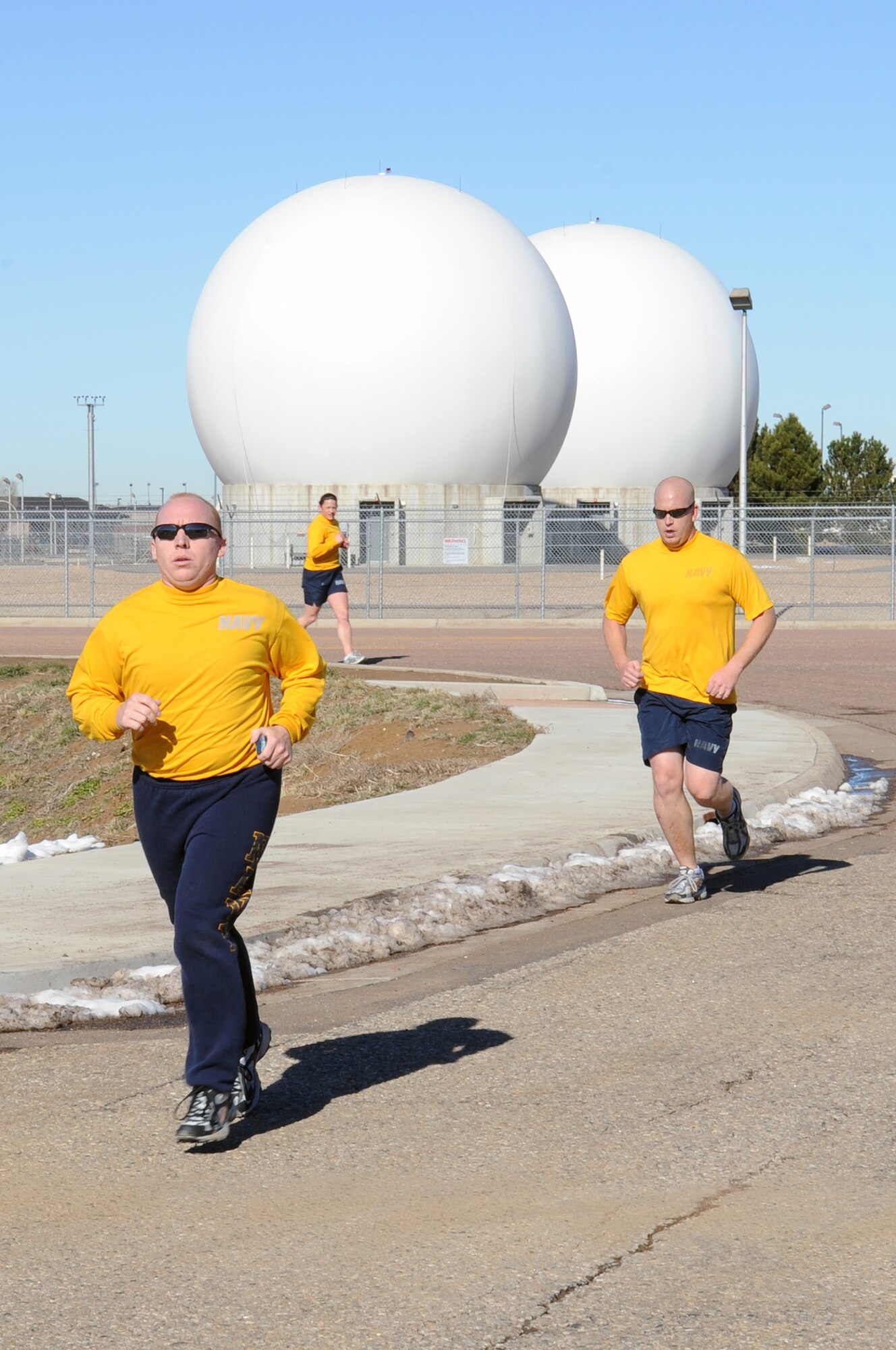 BUCKLEY AIR FORCE BASE, Colo. -- Team Buckley runners speed toward the finish line during the annual Turkey Trot Nov. 18. First-place finishers were awarded a free turkey. (U.S. Air Force photo by Airman First Class Marcy Glass)