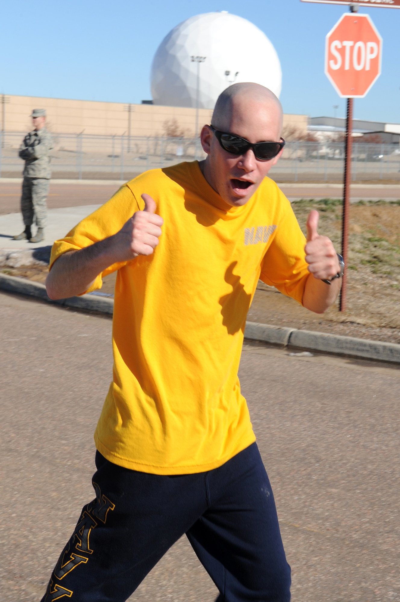 BUCKLEY AIR FORCE BASE, Colo. -- Navy Petty Officer 3rd Class Shawn Longa gives a thumbs-up during the Turkey Trot Nov. 18. First-place winners were awarded a free turkey. (U.S. Air Force photo by Airman First Class Marcy Glass)