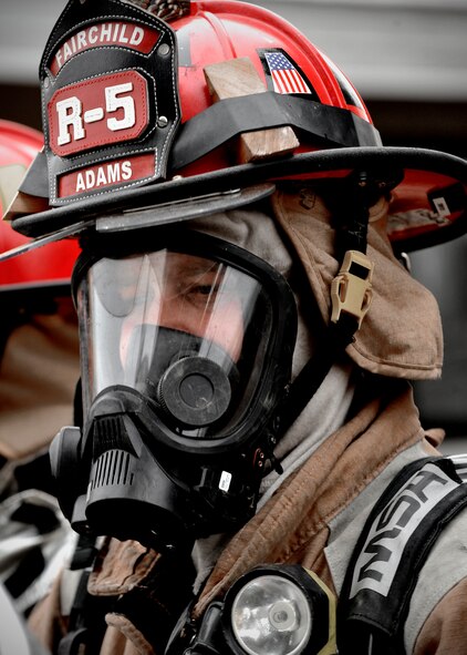 FAIRCHILD AIR FORCE BASE, Wash. - Firefighters here train in their craft in base housing units set for demolision Nov. 16. The Fairchild fire department set sections of these units on fire to help prepare for real-world emergencies. (U.S. Air Force photo / Senior Airman Joshua K. Chapman)