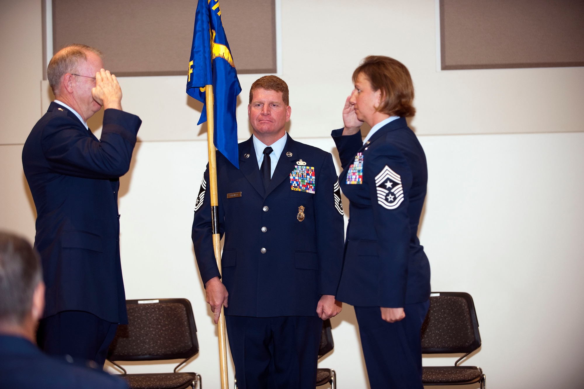 Command Chief Master Sgt. Annadele F. Kenderes accepts authority as Colorado?s newest state command chief master sergeant from Colorado Air National Guard Commander Brig. Gen. Bill Hudson during a ceremony at Buckley Air Force Base, Colo., Oct 4, 2009. (U.S. Air Force photo by Master Sgt. John Nimmo, Sr.) (Released)
