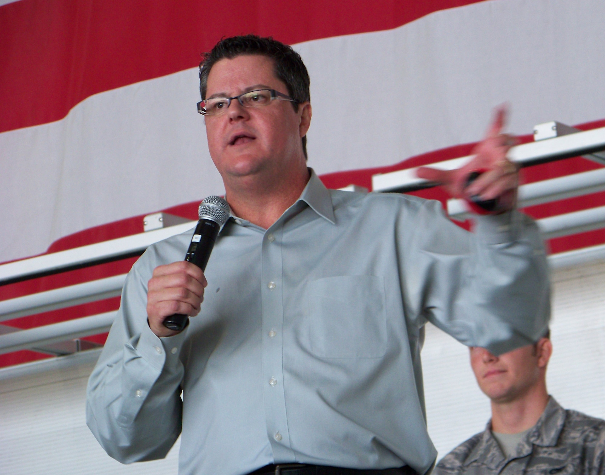 Curtis Zimmerman speaks to the audience during a Wingman Day briefing at Freedom Hangar Nov. 16. Mr. Zimmerman has spoken about reinforcing the wingman concept to more than 14,000 Airmen since 2005. (Air Force photo by Airman 1st Class Joe McFadden.)