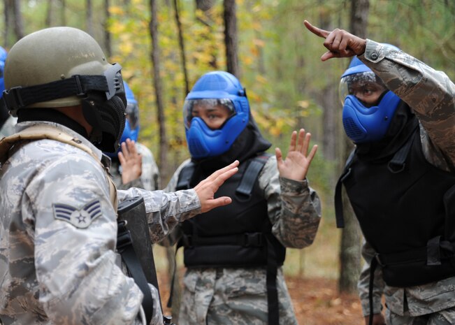 Senior Airman Michael Rodriguez prevents opposing forces members from gaining entry to the forward operating base during the Expeditionary Combat Skills Training field exercise at Charleston AFB Nov. 18. During the FTX there are several different scenarios enacted to see how Airmen will respond. Airman Rodriquez is a special handling journeyman with the 437th Aerial Port Squadron. (U.S. Air Force photo/Senior Airman Katie Gieratz)(RELEASED)