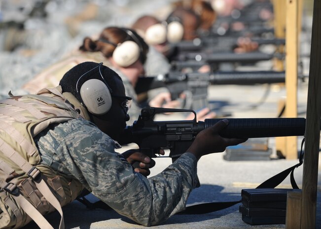 Airman 1st Class Joseph Campbell shoots his M-16 A2 during weapons qualification training at the Naval Weapons Station Charleston Nov. 16. Students must complete the weapons qualification training and learn how to handle, maintain and clean their weapons during the Expeditionary Combat Skills Training Course. Airman Campbell is a customer service specialist with the 437th Logistics Readiness Squadron. (U.S. Air Force photo/Senior Airman Katie Gieratz)(RELEASED)