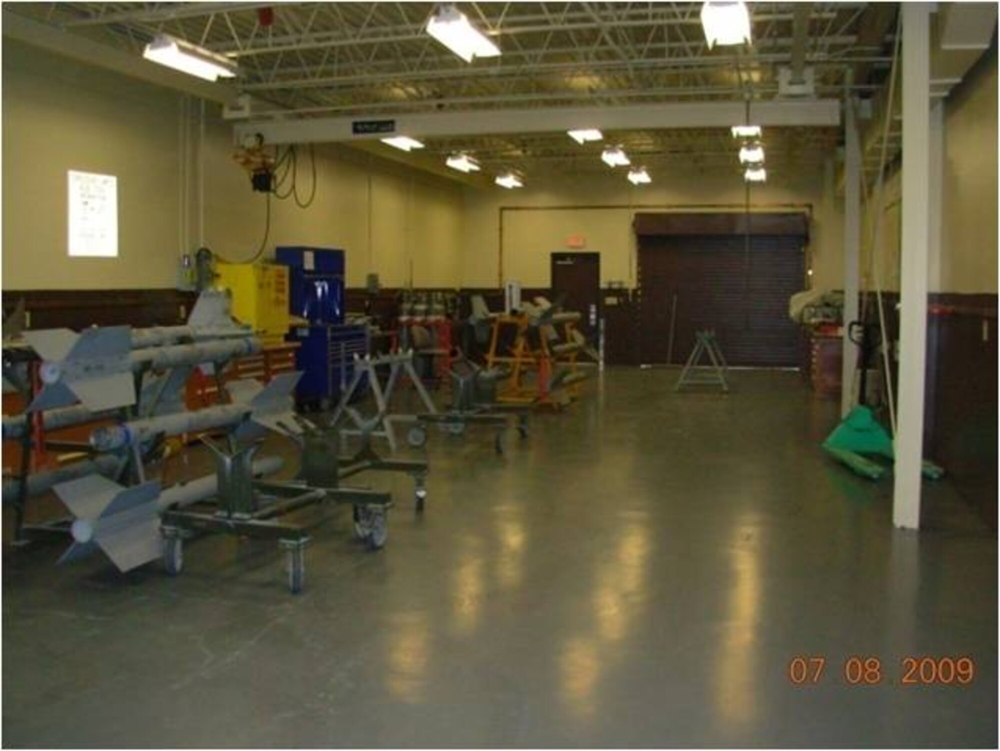 Tyndall spent $65,300 of the Recovery and Reinvestment Act money on repainting the munitions building. Both exterior and interior surfaces were painted including walls, fascia trim, roll-up/regular doors, downspouts and the interior bays. Tyndall received $23.3 million in 2009 as part of the Recovery and Reinvestment Act, a stimulus package signed by President Barack Obama on Feb 17 to jumpstart the American economy.   (U.S. Air Force courtesy photo)