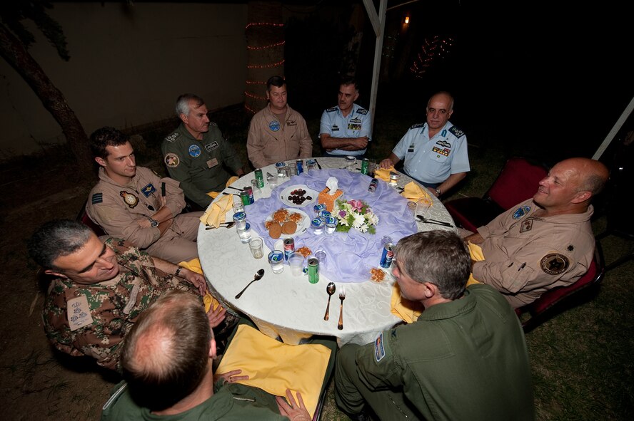 Leadership from the Royal Jordanian Air Force, Belgium Air Force, South Carolina Air National Guard and the Colorado Air National Guard talk during the culture night celebration October 26, 2009, Mwaffaq Salti Air Base, Jordan, during Falcon Air Meet 2009.  The Falcon Air Meet is a friendly competition centered on the F-16 Fighting Falcon. F-16 units from Jordan, Belgium and the 169th Fighter Squadron from the South Carolina Air National Guard competed in this 4th annual event hosted in Jordan.  As in past Falcon Air Meets members of all the participating countries will often get together to learn of each others cultures and enjoy each others company when they are not competing in the annual events that brought them together in the first place.   (U.S. Air Force photo by Tech. Sgt. Wolfram M. Stumpf) (Released)