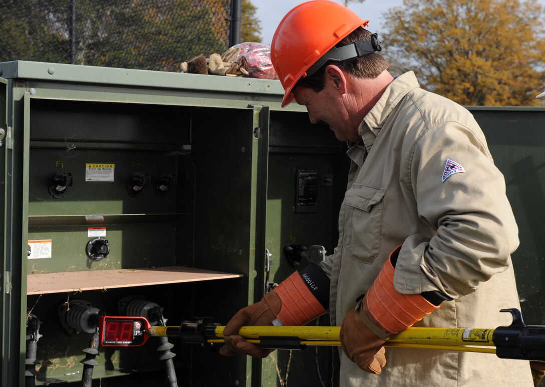 LANGLEY AIR FORCE BASE, Va. --  Rick Minks, 1st Civil Engineer Squadron Electrical Systems technician, tests the high-voltage side of the transformer Nov. 17.  Last week, a nor'easter struck Langley and damaged power lines.  (U.S. Air Force photo/Senior Airman Zachary Wolf) 