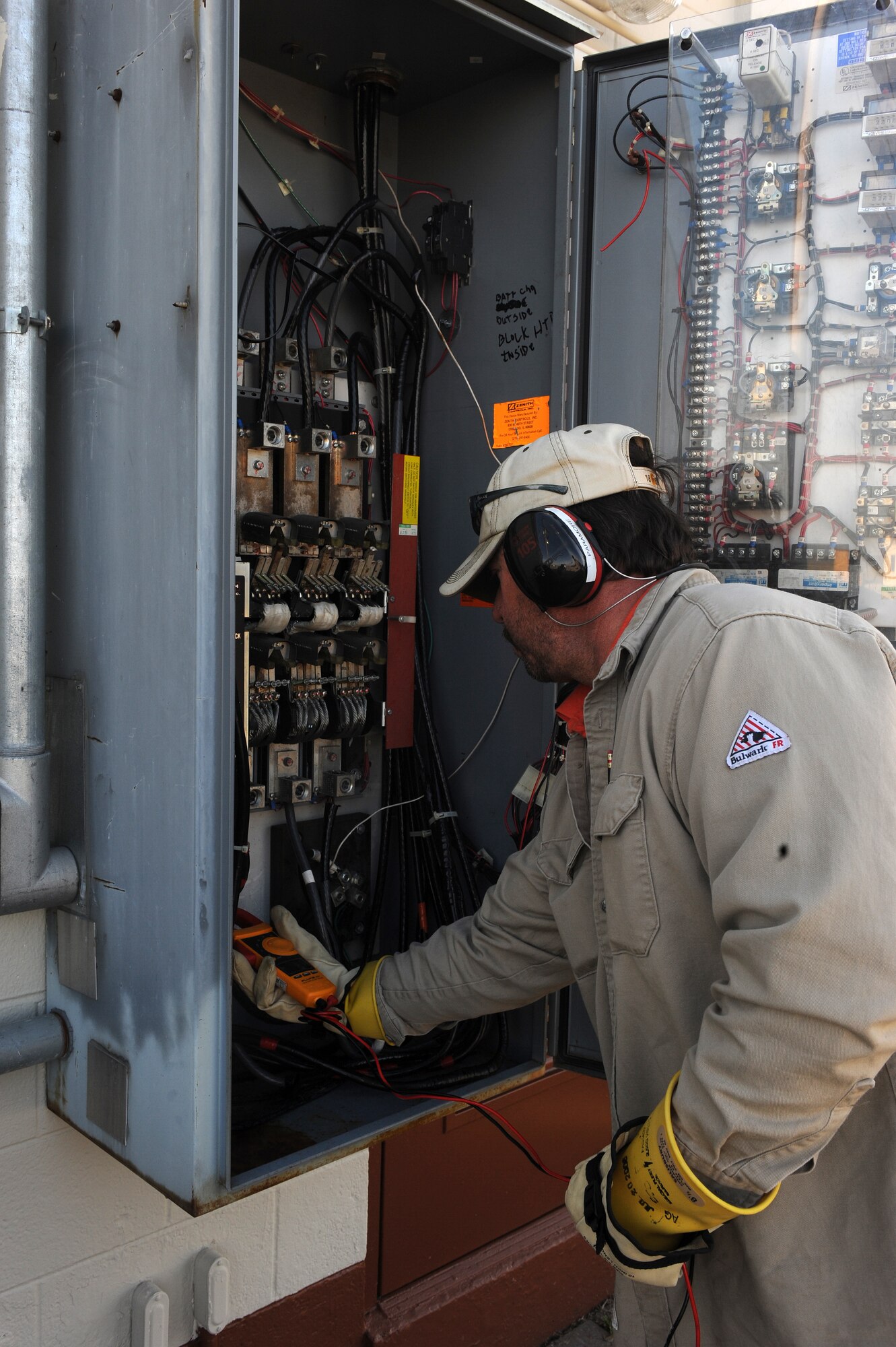 LANGLEY AIR FORCE BASE, Va. -- Don Paramore, 1st Civil Engineer Squadron Power Production Maintenance mechanic, inspects components of a generator Nov. 17.  The generator powers flight line lights and requires and inspection because a nor'easter flooded Langley last week.  (U.S. Air Force photo/Senior Airman Zachary Wolf) 