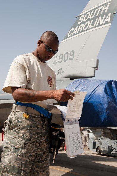 An airman from the 169th Fight Squadron South Carolina Air National Guard goes over his check list as he participates in the Weapons Load competition October 25, 2009, Mwaffaq Salti Air Base, Jordan, during Falcon Air Meet 2009.  The Falcon Air Meet is a friendly competition centered on the F-16 Fighting Falcon. F-16 units from Jordan, Belgium and the 169th Fighter Squadron from the South Carolina Air National Guard competed in this 4th annual event hosted in Jordan.  (U.S. Air Force photo by Tech. Sgt. Wolfram M. Stumpf) (Released)