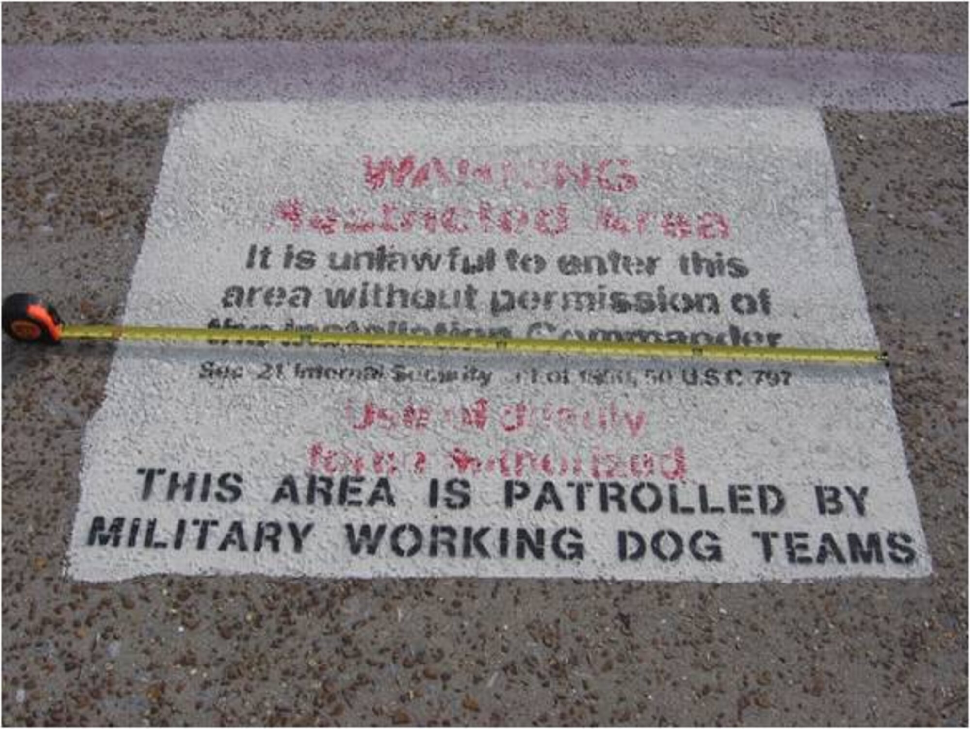 BEFORE: Faded red lines and illegible print caused safety hazards on the flight line. Tyndall dedicated $318,000 of the Recovery and Reinvestment Act money to routine airfield maintenance. Tyndall received $23.3 million in 2009 as part of the Recovery and Reinvestment Act, a stimulus package signed by President Barack Obama on Feb 17 to jumpstart the American economy. (U.S. Air Force courtesy photo)