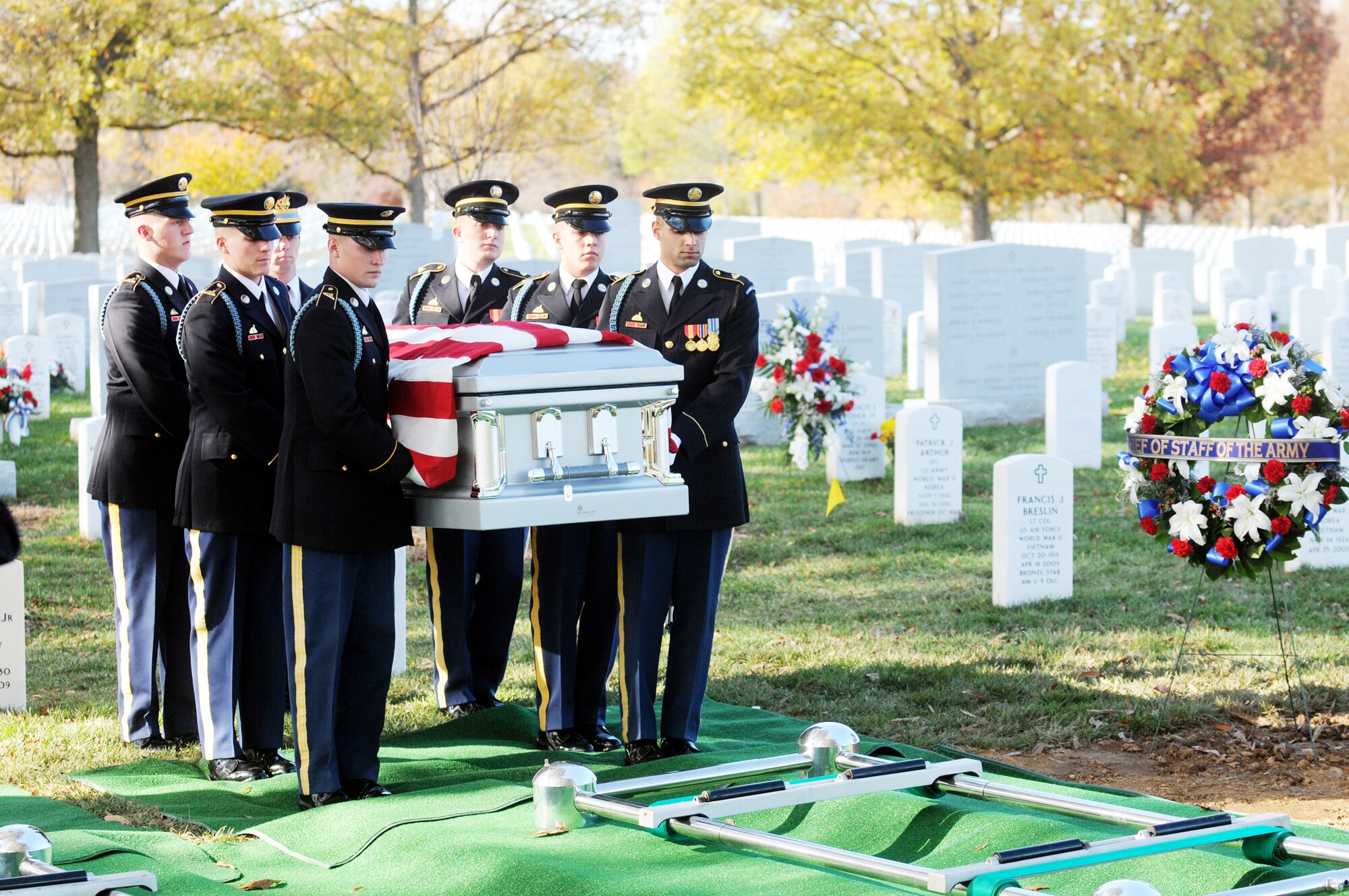 Several military members carry the remains of a fallen servicemember of the World War II B-25 aircrew that were lost Dec. 5, 1942, near Papua, New Guinea, at an interment ceremony in Arlington National Cemetery in Virginia. (Defense Department photo/Navy Petty Officer William Selby)