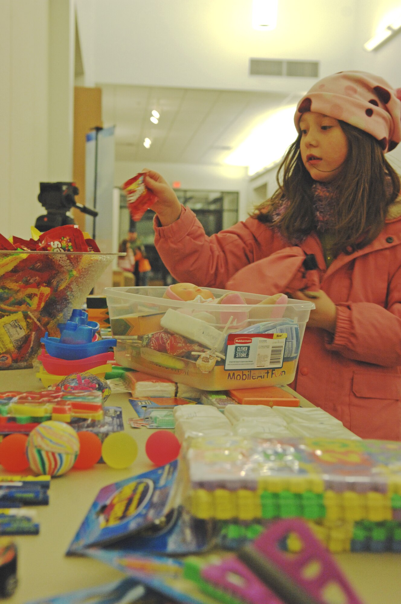 Gabrielle D'Ippolito picks out candy and other items to fill a shoebox Nov. 12, 2009, Eielson Air Force Base, Alaska. Volunteers filled shoeboxs with candy, toys and toiletries at the base chapel as a part of Operation Christmas Child. Gabrielle is the child of  Lt. Col. Andrew D'Ippolito, 354th Communications Squadron commander. (U.S. Air Force photo/ Airman 1st Class Rachelle Coleman)