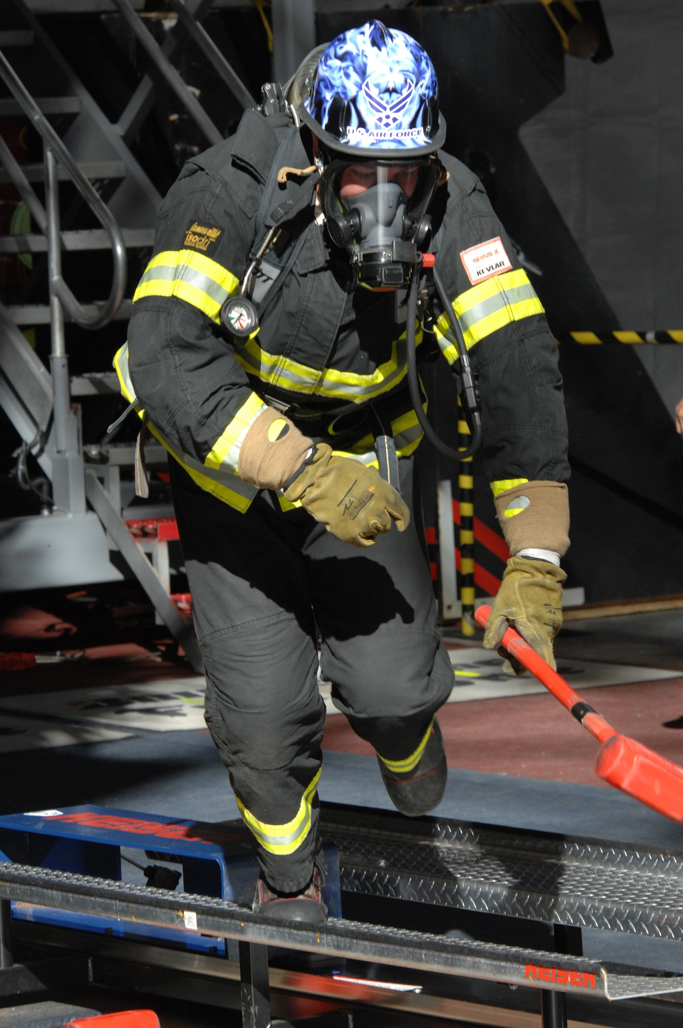 LAS VEGAS -- Airman First Class Timothy Vanden Haak, 509th Civil Engineer Squadron firefighter, runs from a Kaiser sled to the next portion of his event during the 2009 Scott Firefighter Combat Challenge, Nov. 16. As part of the competition, the firefighters will climb a five-story tower, hoist and chop, drag hoses and rescue a life-sized 175-pound "victim," while racing against themselves, their opponents, and the clock. (U.S. Air Force photo/Airman 1st Class Carlin Leslie)(Released)