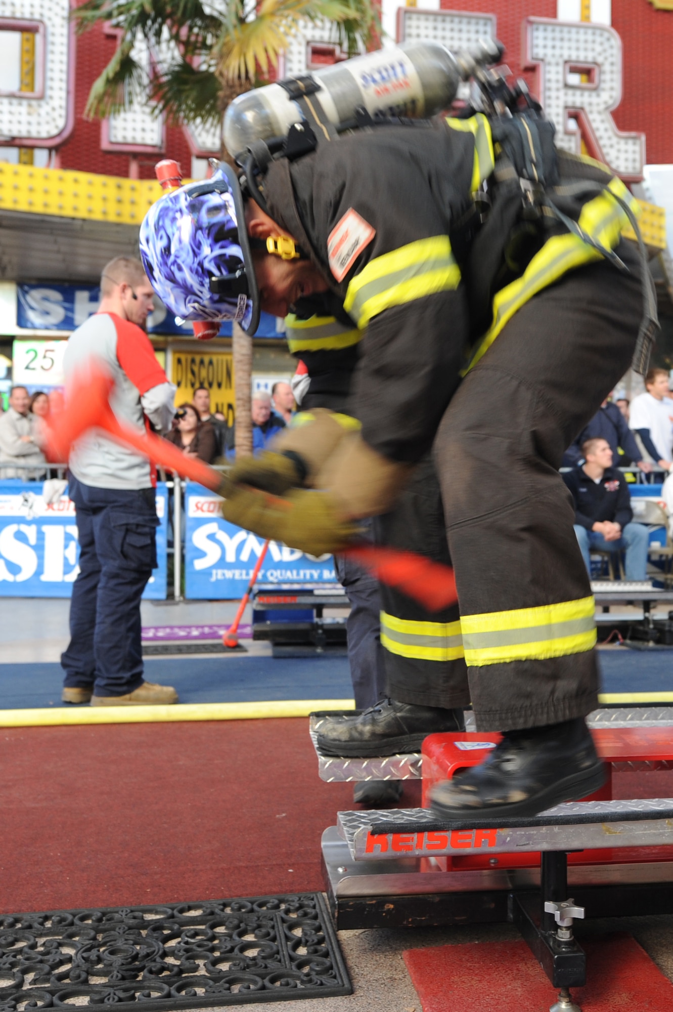 LAS VEGAS -- Tech. Sgt. Corey McGee, 509th Civil Engineer Squadron firefighter and lead combat coach, pounds away at the Kaiser sled during the 2009 Scott Firefighter Combat Challenge, Nov. 16. During the competition, the firefighters will climb a five-story tower, hoist and chop, drag hoses and rescue a life-sized 175-pound "victim," while racing against themselves, their opponents, and the clock. (U.S. Air Force photo/Airman 1st Class Carlin Leslie)(Released)