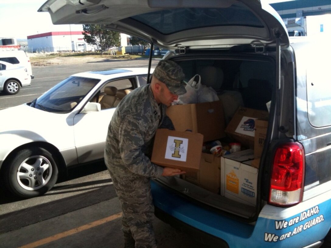 Wing members donated 320 pounds of food to the Idaho Foodbank during the Hunger Bowl food drive Nov. 1-13 in a friendly competition that pitted Vandals fans against Broncos fans in the name of helping the hungry. Capt. Tony Vincelli (pictured), 124th Wing Public Affairs Officer and John Spurny, family program coordinator, delivered the donations to the Idaho Foodbank distribution center in Boise Nov. 18 on behalf of the 124th Fighter Wing Company Grade Officers Council, which sponsored the food drive. (Air Force photo by John Spurny)(Released)