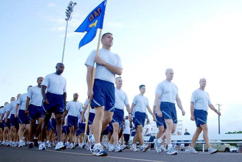 Members of 13th Air Force march before beginning a warrior run during Jungle Day Nov. 13, 2009, at Hickam Air Force Base, Hawaii. The Jungle Day tradition originated when the organization was assigned to Andersen AFB, Guam, and gives 13th Air Force members a chance to have fun and give back to the local community. (U.S. Air Force photo/Senior Airman Gustavo Gonzalez)
