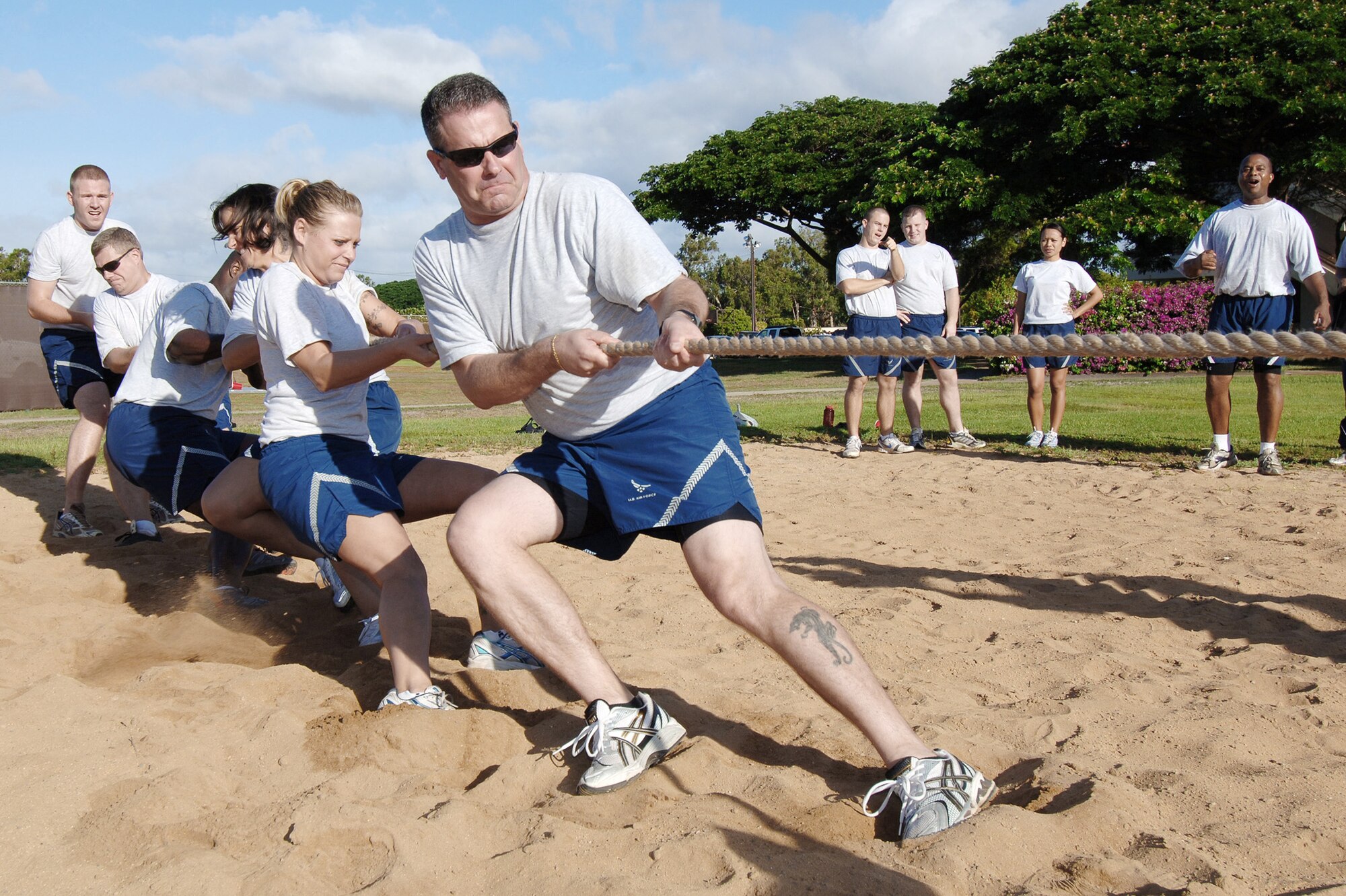 Members of 13th Air Force compete in a tug-of-war battle during a Jungle Day sporting event held Nov.13, 2009, at Hickam Air Force Base, Hawaii. Jungle Day is a tradition that originated when the organization was assigned to Andersen AFB, Guam, and gives 13th Air Force members a chance to have fun and give back to the local community. (U.S. Air Force photo/Vanessa M. Forloine)