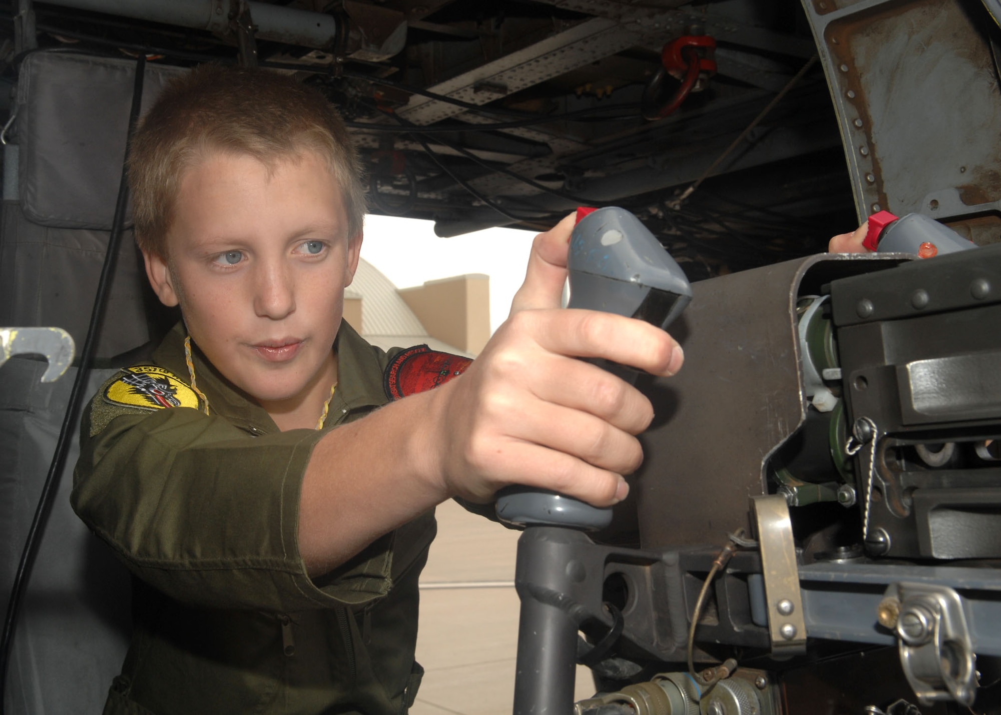 Pilot for a Day participant, Jake McKay, experiences an HH-60 Pavehawk static display as part of his base tour Nov. 13. The Pilot For A Day program benefits children from the local Tucson community with disabilities or serious illnesses. (U.S. Air Force photo/ Airman Jerilyn Quintanilla)
