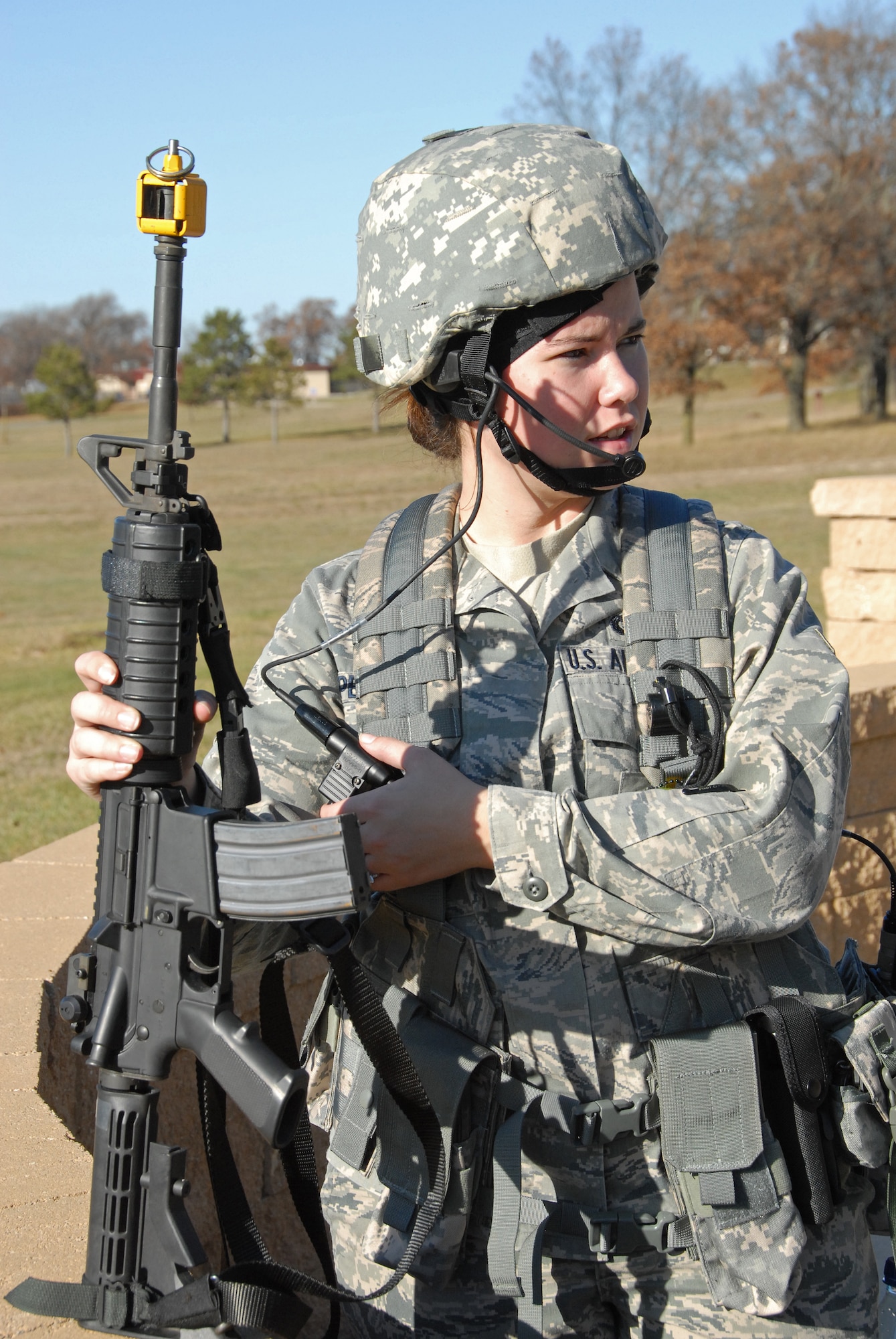 Airman 1st Class Angela Peterson, fire team member with the 115th Fighter Wing Security Forces performs a functional check of her radio equipment prior to beginning a combat training exercise at Volk Field, Air National Guard Base, Camp Douglas, Wis. Nov. 7, 2009.The Madison, Wis. based 115th Security Forces Squadron engaged in a variety of combat training exercises as part of their November Unit Training Assembly. (U.S. Air Force photo by Master Sgt. Paul Gorman)