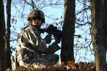 Senior Airman Leigh Downing, fire team member with the 115th Fighter Wing Security Forces establishes a defensive position from which to provide cover fire during a training exercise at Volk Field Combat Readiness Training Center, Wis. Nov. 7, 2009. The Madison, Wis. based 115th Security Forces Squadron engaged in a variety of combat training scenarios as part of their November Unit Training Assembly. (U.S. Air Force photo by Master Sgt. Paul Gorman)
