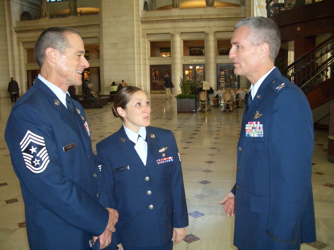 Col. Steven Chapman (right), commander of the 315th Airlift Wing, Charleston AFB, S.C., along with Chief Master Sgt. Ben Futrell, 315th Airlift Wing Command Chief Master Sgt. and Staff Sgt. Maria Baird, 315th Aeromedical Evacuation Squadron, waits to visit members on Congress during the wing's annual Capitol Hill visit. (Air Force Photo/Capt. Wayne Capps)