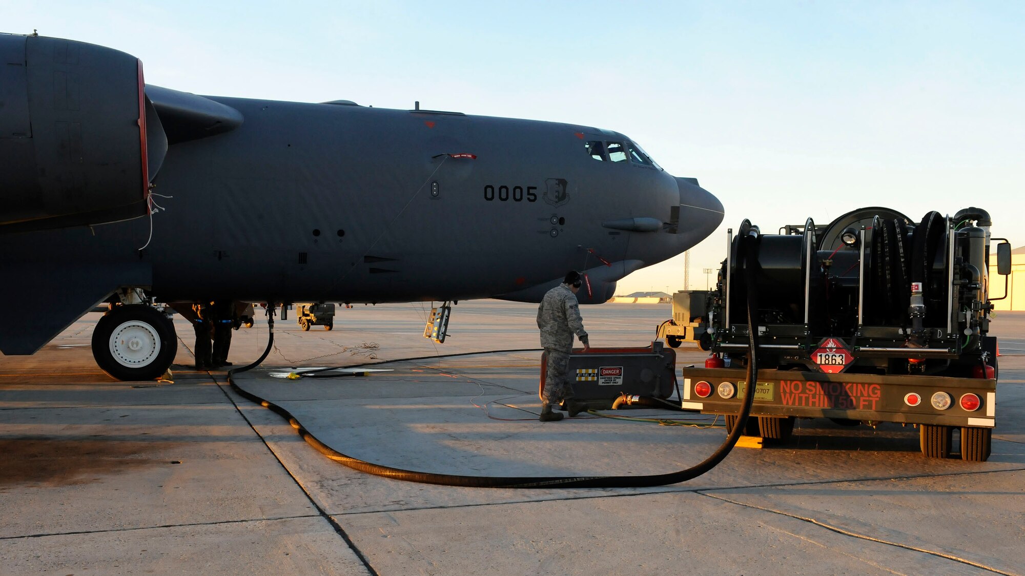 MINOT AIR FORCE BASE, N.D. -- A 23rd Bomb Squadron B-52H Stratofortress is refueled by members of the 5th Logistics Readiness Squadron fuels flight on the mass parking area here Nov. 17. Refueling Minot’s muscle is just one of many mission essential tasks performed by 5th LRS Airmen. (U.S. Air Force photo by Senior Airman Matthew Smith)