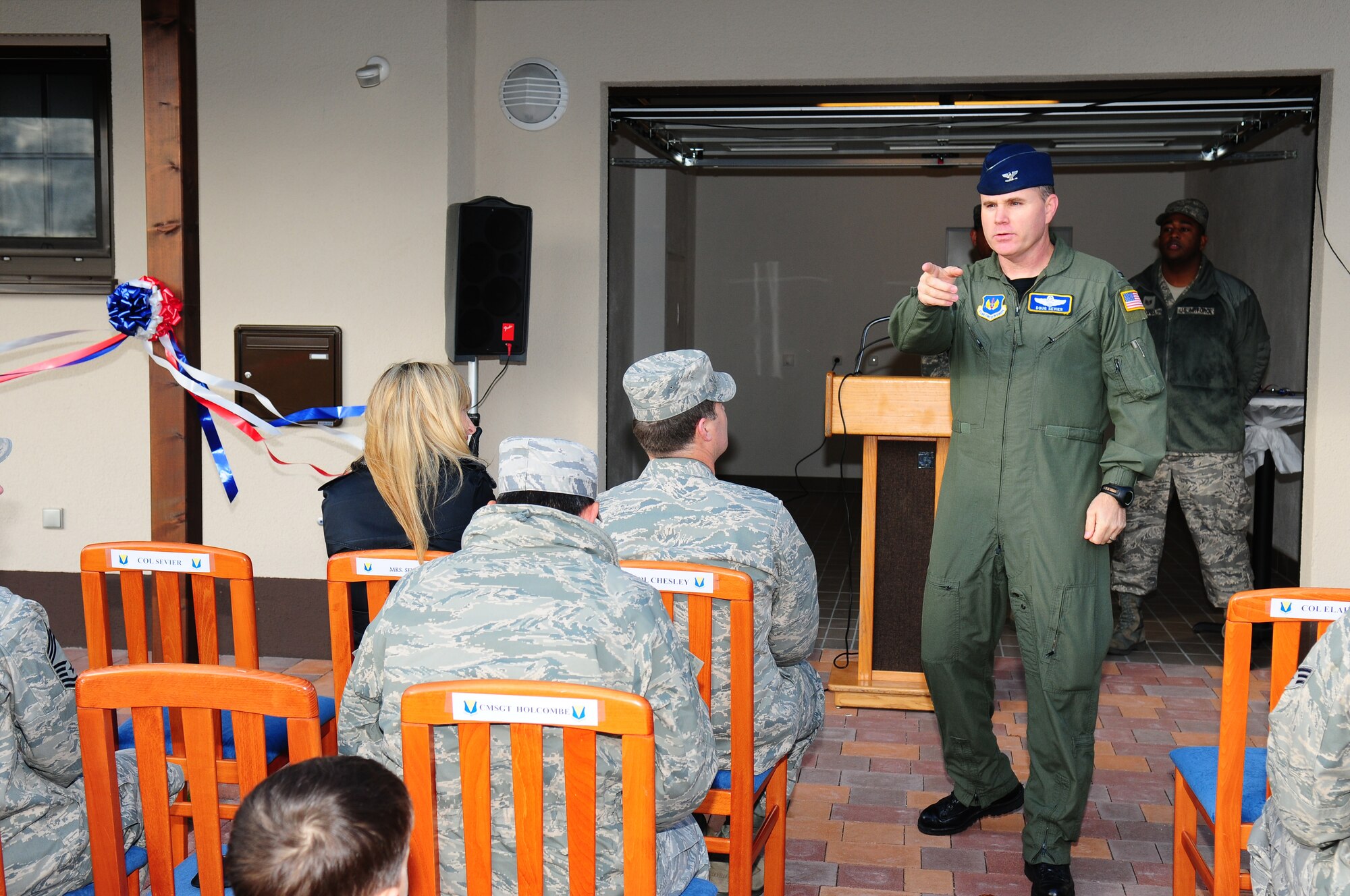 U.S. Air Force Colonel Douglas Sevier, 86th Airlift Wing vice commander, speaks to special guests and new tentents of the newly completed four house complex at Ramstein Air Base, Germany with the families that have been issued the homes on November 18, 2009.  This set of houses marks 776 townhouse units complete of the 833 units to be built.  The $343 million dollar project is expected to be done some time next year. The new units will be open to Airman and Soldiers in the Kaiserslautern Military Community. (U.S. Air Force Photo by Staff Sgt. Jocelyn Rich)