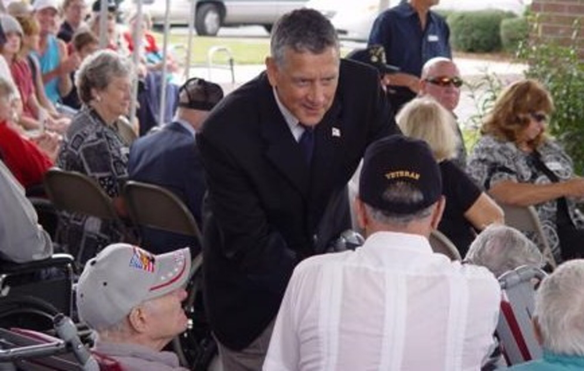 Lieutenant Colonel Tom Castriota, USMC Retired, presents medals to veterans from WWII and the Korean War (Photo by Art Hagedon)