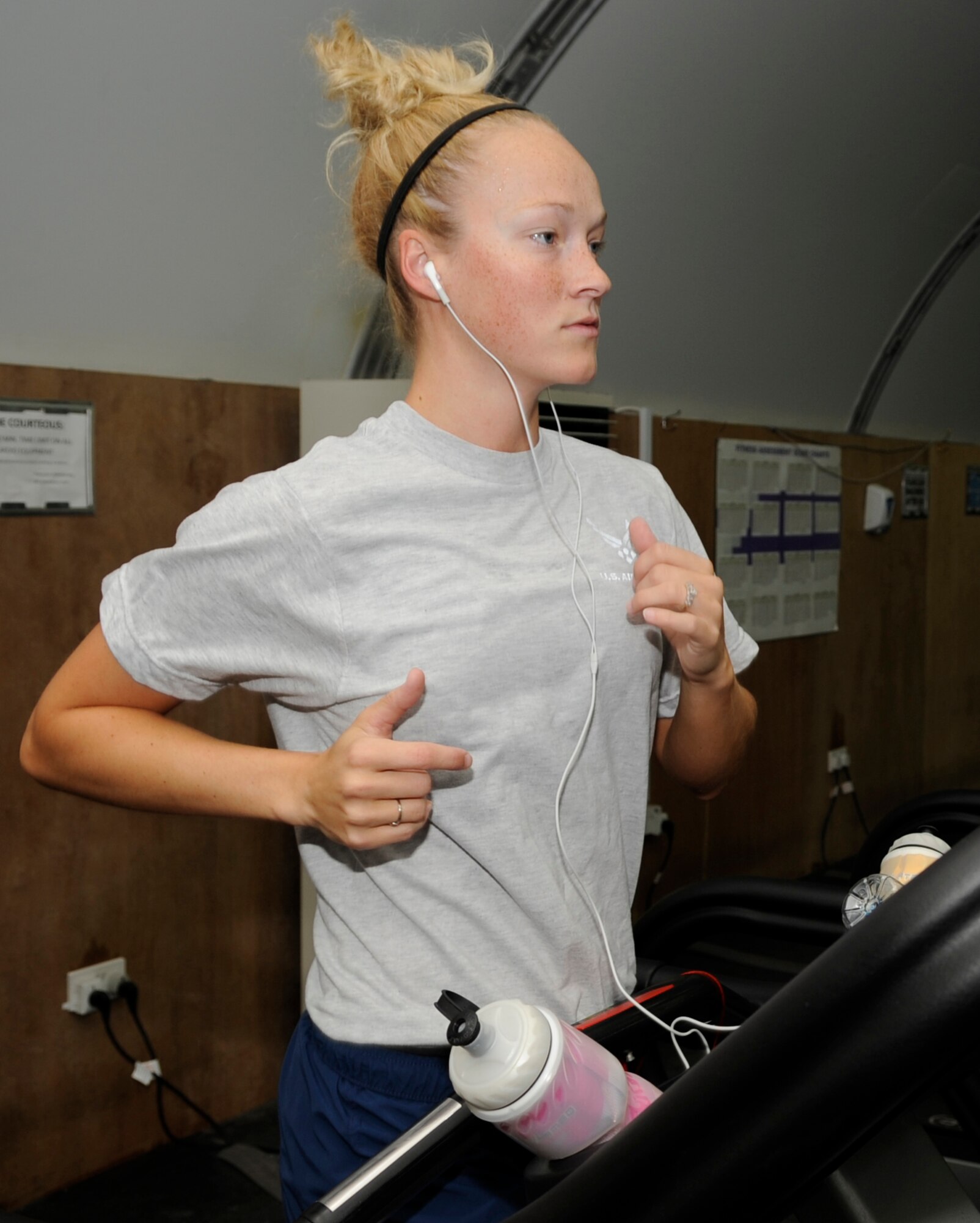 SOUTHWEST ASIA - 1st Lt. Anna Johnson, 960th Expeditionary Airborne Air Control Squadron, runs on a treadmill Nov. 18, 2009. Lieutenant Johnson joined the 450 mile club Nov. 17, 2009. The mile club is an incentive program offered by the 380th Expeditionary Force Support Squadron that gives servicemembers a free shirt according to the number of miles they run while deployed here. She is deployed from Tinker Air Force Base, Okla., and hails from Springfield, Ore.(U.S. Air Force photo/Senior Airman Stephen Linch)
