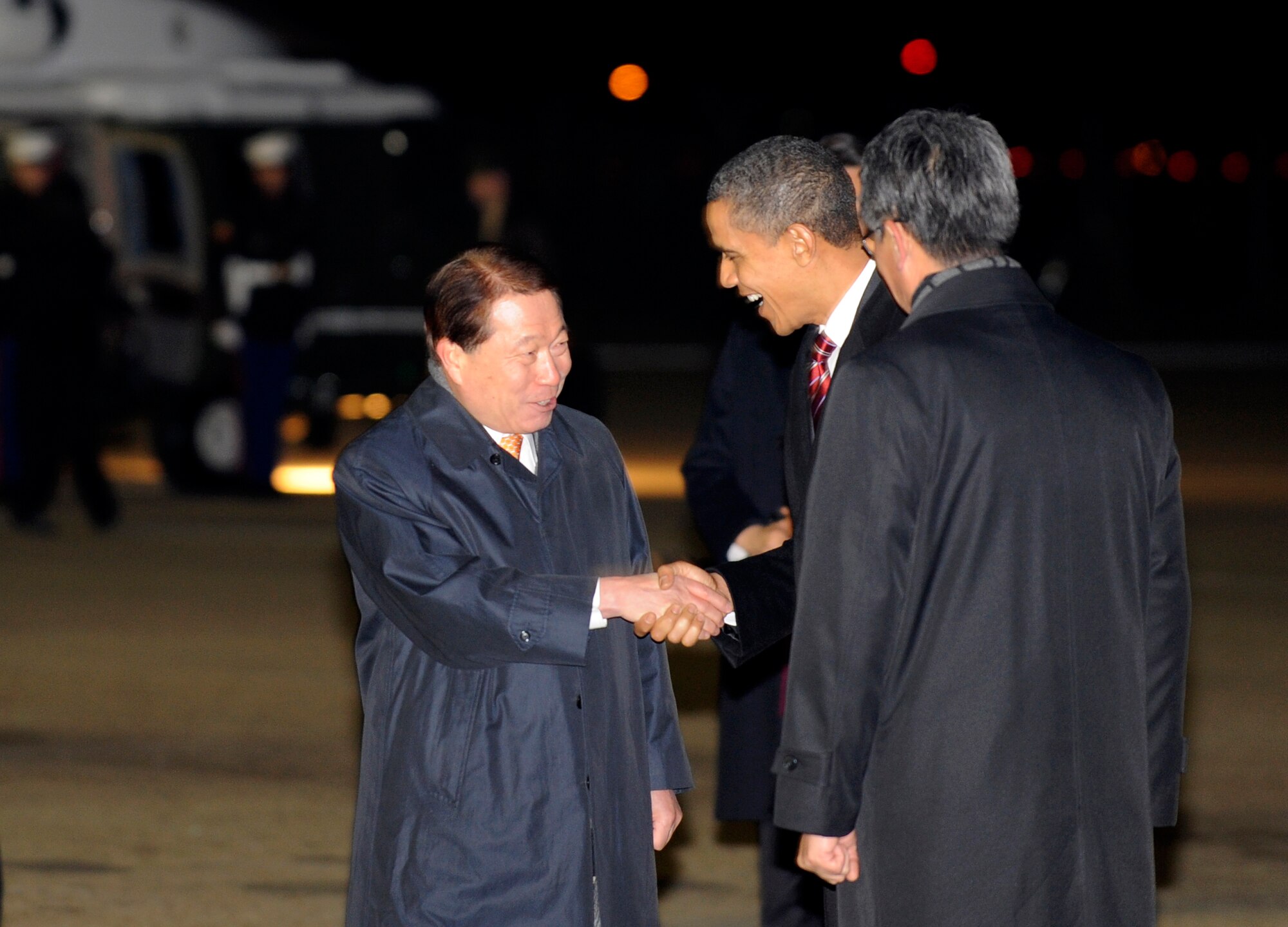 U.S. President Barack Obama shakes hands with Republic of Korea Foreign Minister Yu Myung-hwan after arriving at Osan Air Base, Republic of Korea, Nov. 18, 2009.  This is President Obama's first visit to Korea since taking office in January.  President Obama will address troops at Osan Thursday before returning to the U.S. (U.S. Air Force photo/Staff Sgt. Brian Ferguson)
