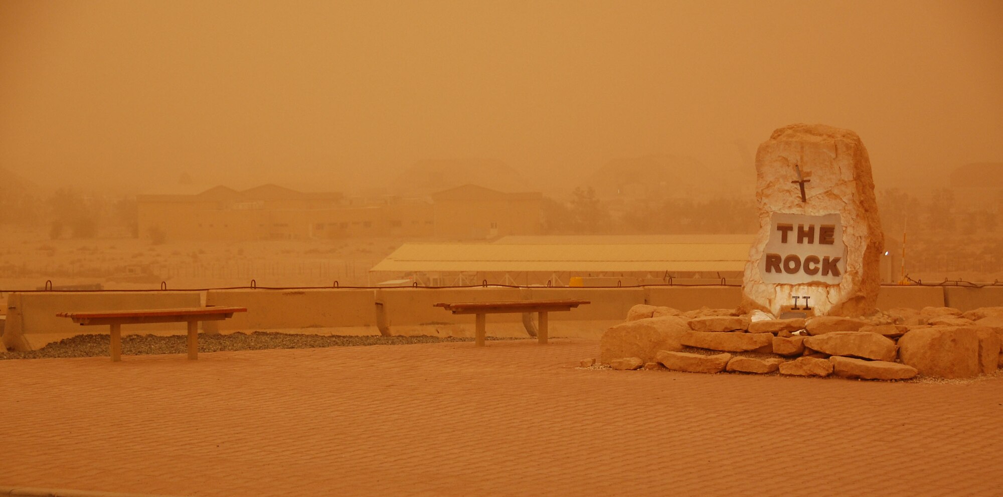 SOUTHWEST ASIA - An orange sky can be seen behind "The Rock" here at the 386th Air Expeditionary Wing as a dust storm passed through the region the afternoon of Nov. 17, 2009 (U.S. Air Force Photo/Capt. Larry van der Oord)