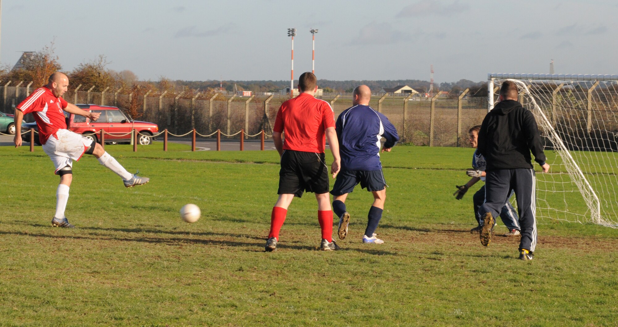 RAF MILDENHALL, England -- Pete Webb, 727th Air Mobility Squadron player, shoots wide of the goal during the last few minutes of normal time in the intramural soccer play-off game against the 488th Intelligence and 95th Reconnaissance Squadrons Nov. 17. The 488th IS/95th RS went on to win the game 4-3 after extra-time to take their team into the semi-finals.  (U.S. Air Force photo/Gary Rogers) 