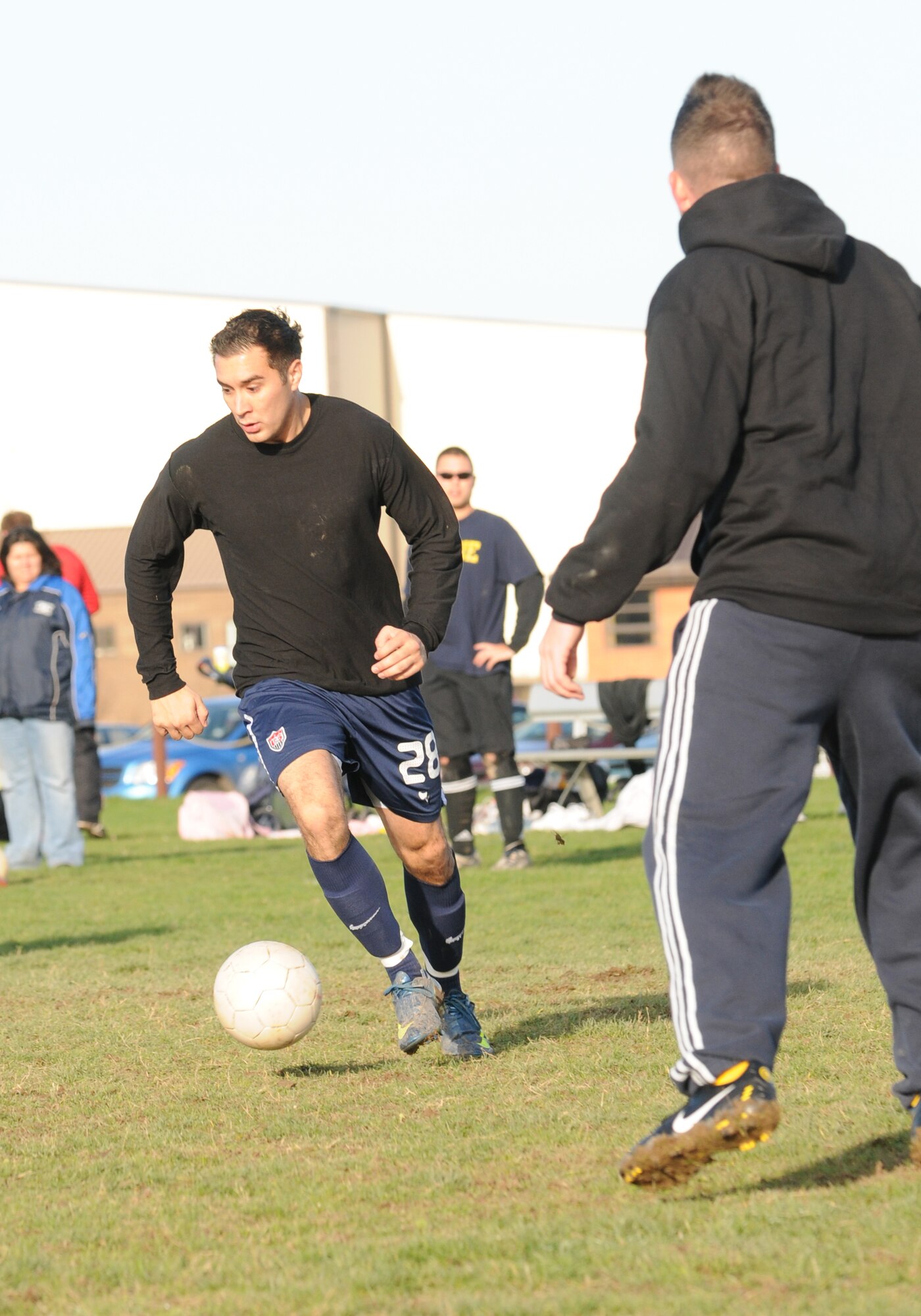 RAF MILDENHALL, England – Daniel Acosta, (on the ball) scored the winning goal for the 488th Intelligence and 95th Reconnaissance Squadrons in the play-off game against the 727th Air Mobility Squadron at the Hardstand Fitness Center Nov. 17.  The game went into extra-time after the score was tied at 3-3. (U.S. Air Force photo/Senior Airman Tomas Trower) 