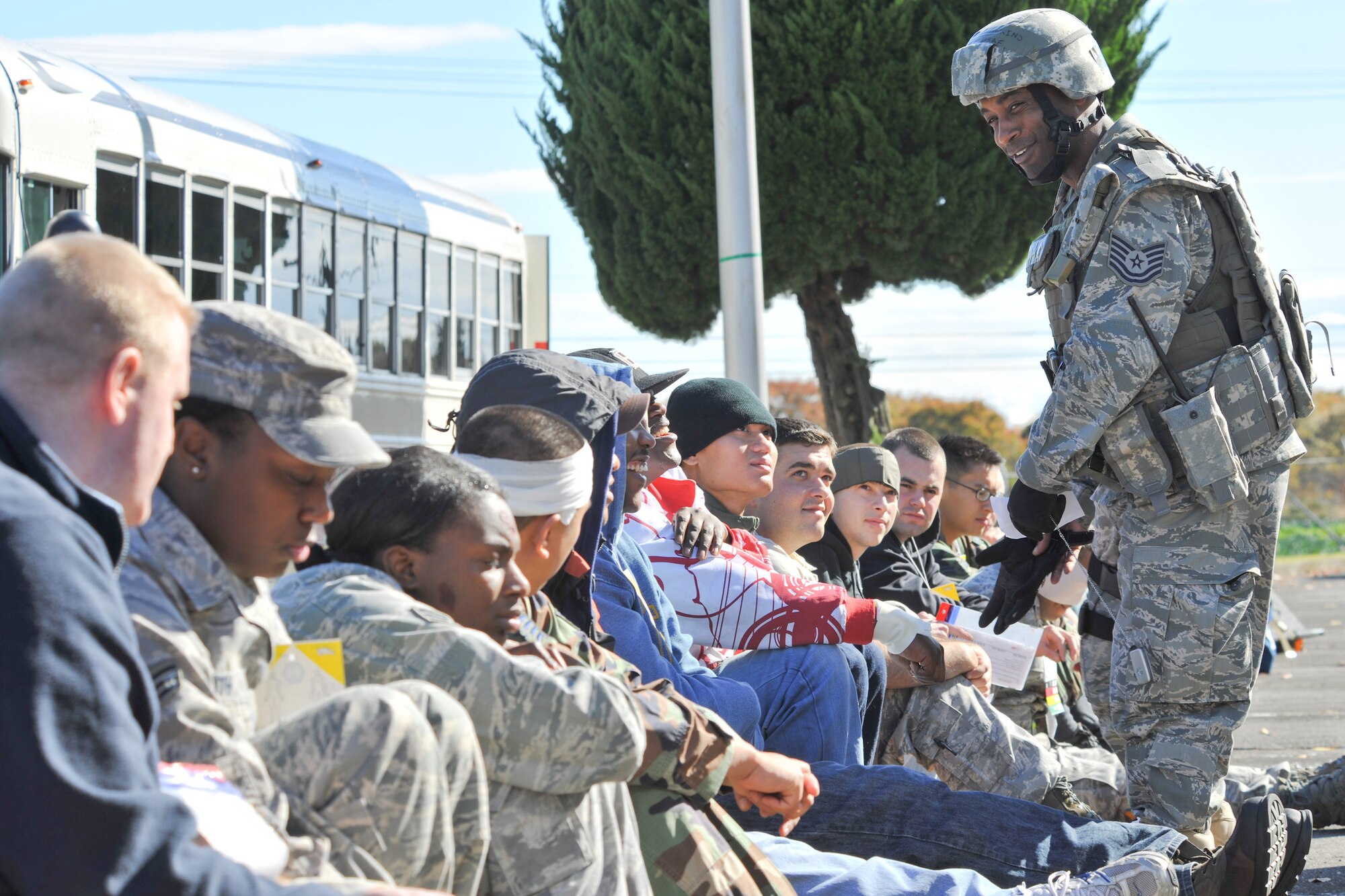 YOKOTA AIR BASE, JAPAN -- Tech. Sgt. Shawn Hawkins, 374th Security Forces Squadron, confirms patients' vitals on a casualty information tags following a simulated mass casualty exercise Nov. 18 during Phase II Exercise Beverly Morning 10-01. Yokota is conducting an exercise Nov. 18 through Nov. 20 to maintain operational readiness.(U.S. Air Force photo/Osakabe Yasuo)