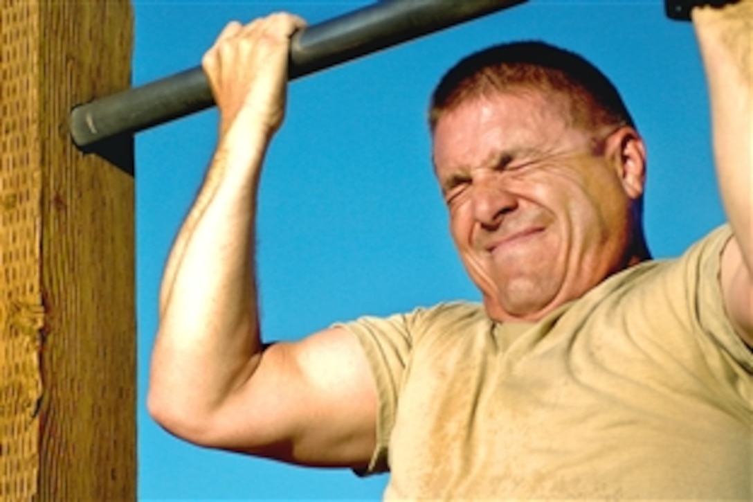 A U.S. Army Ranger candidate performs one of six mandatory pull-ups during the Ranger Physical Fitness Test held on Fort Irwin, Calif., Nov. 3, 2009. The fitness test is the first event during the three-day assessment sponsored by the 11th Armored Cavalry Regiment.