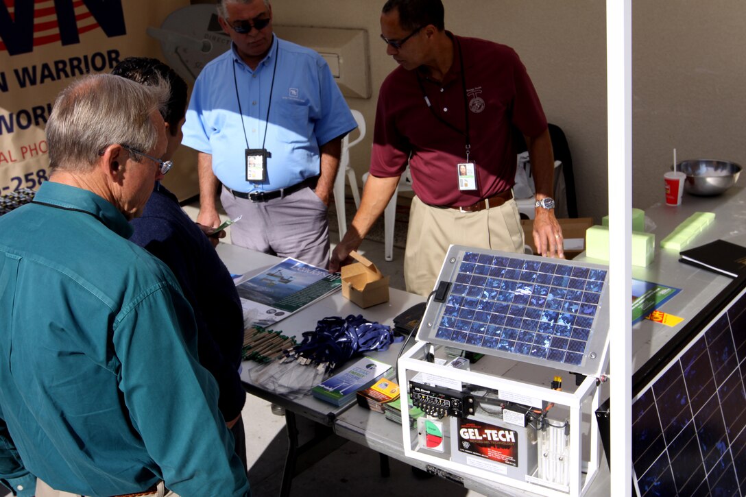 ::r::::n::Charles Howell, resource efficiency manager, Base Energy Office, Camp Pendleton explains the ability of solar-power to  Department of Defense employees during an energy awareness day even held by the Base Energy Office at the Mainside Center, Nov. 19.::r::::n::