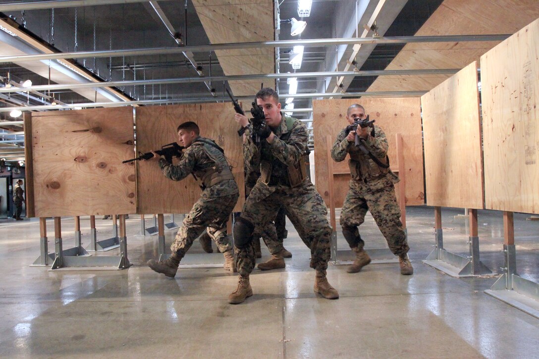 Marines clear a room during a counter-terrorism course at the Indoor Small-Arms Range here Nov. 19. The course was a week long and instructed by former members of the Israeli Task Force. The course was designed for members of the Special Reaction Team but was open to other Marines.