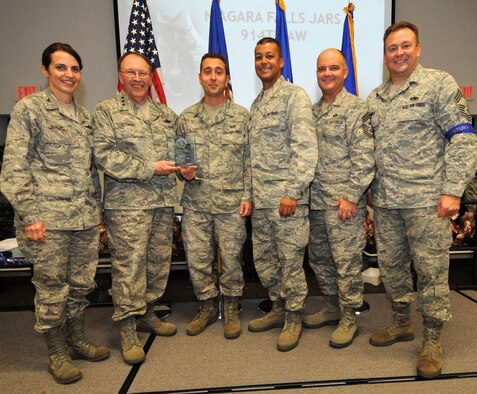 NIAGARA FALLS AIR RESERVE STATION, N.Y. -- The 914th Airlift Wing received first place as the top Get One Now program in the Air Force Reserve.  This award was presented October 22 in Savannah, Georgia during the Air Force Reserve Recruiting Command's field training exercise awards banquet.  Pictured from left to right:  Col. Patricia Jarmuz, 914th Aeromedical Staging Squadron commander; Lt. Gen. Charles Stenner Jr., Commander of Air Force Reserve Command; Senior Master Sgt. Pasquale Muoio, 914th Airlift Wing senior recruiter; Col. Joseph Wilburn, Air Force Reserve Recruiting commander; Chief Master Sgt. Dwight Badgett, Air Force Reserve Command Chief Master Sergeant; Chief Master Sgt. Robert Starkey, Air Force Reserve Recruiting Service Manager.  (U.S. Air Force photo)