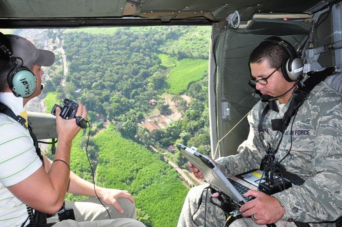 ILOPANGO, El Salvador--Adriel McConnell, a member of U.S. Army Corps of Engineers Mobile District, and Air Force Maj. Leonel Gonzalez, U.S. SOUTHCOM Standing Joint Force Headquarters  Logistics Planner, operate an Automated Route Reconnaissance Kit during a damage assessment mission here Nov. 16. A combined U.S., Salvadoran assessment team is working together to collect data from damage sites and recommend steps to help El Salvador recover from recent floods and landslides. The team conducted aerial reconnaissance, with the support of Joint Task Force-Bravo helicopters, a well as on-the-ground evaluations. (U.S. Air Force photo/1st Lt. Jen Richard)