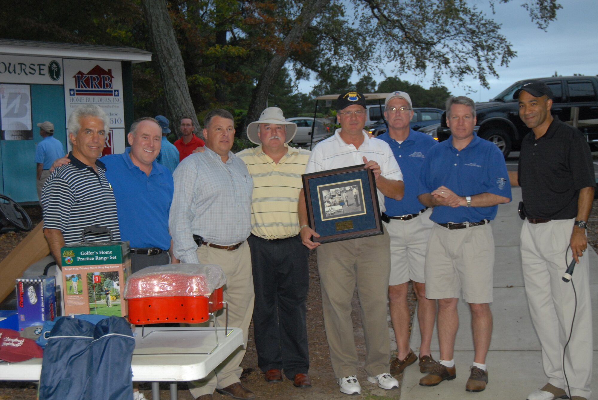(Left to Right) PSAC members Johnny Dawkins, Jay Wyatt, Gary Brown, Robert Grover, Gary Cooper and John Elliott stand with (far left) Neil Grant and (far right) Col. James Johnson, 43rd Airlift Wing Commander, for a group shot during the Joe Barr charity golf tournament. The event raised $7,000 to support a number of Pope organizations.  (U.S. Photo by Senior Airman Mindy Bloem)