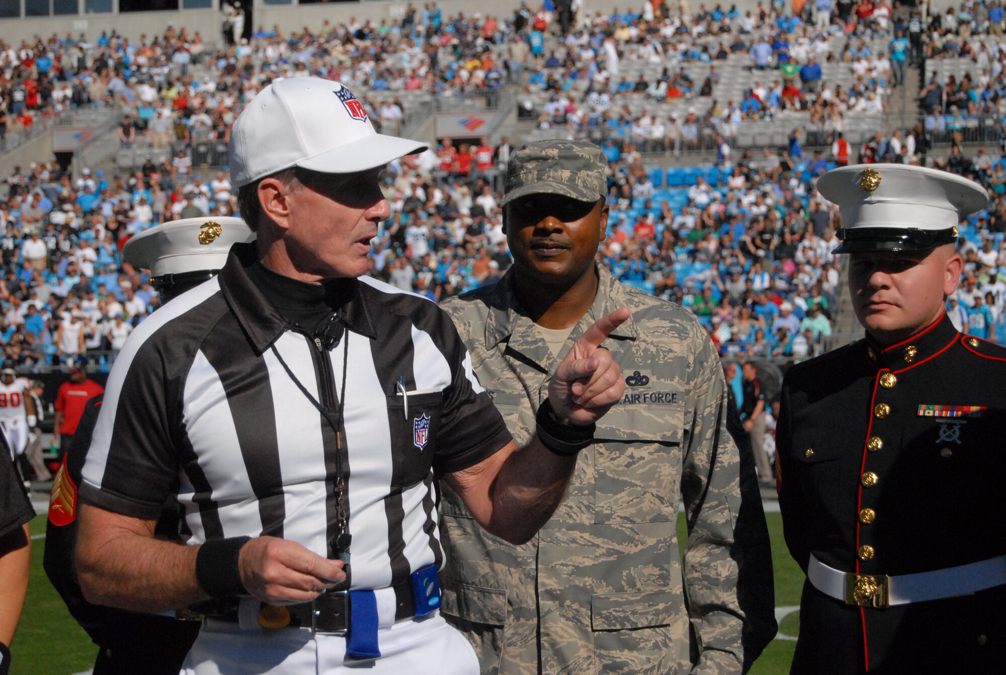 Master Sgt. Dwayne Harris, 43rd Logistics Readiness Squadron, was selected to participate in Operation Game Day at the Carolina Panthers vs. Atlanta Falcons game in Charlotte, N.C. Nov. 15. Operation Game Day was created to recognize and honor servicemembers from the Air Force, Army, Marines, Navy and Coast Guard. A local high school sang the National Anthem. (U.S. Air Force Photo by 2nd Lt. Cammie Quinn)