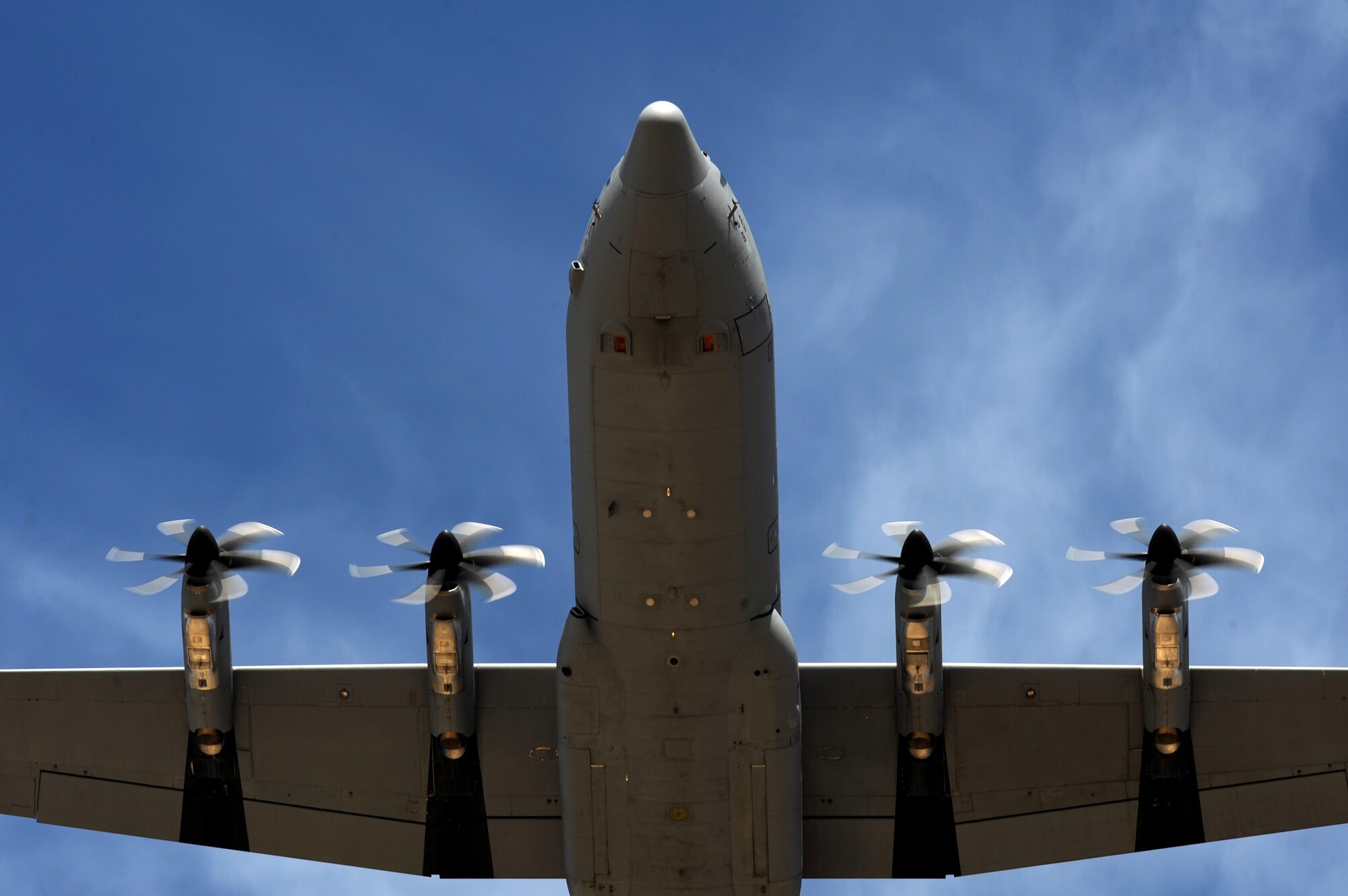 NEVADA TEST AND TRAINING RANGE -- A C-130 Hercules from Ramstein Air Force Base, Germany flys over the Urban Operations Complex drop zone in the Nevada Test and Training Range during the U.S. Air Force Weapons School Mobility Air Forces Exercise. The aircraft is part of the bi-annual, U.S. Air Force Weapons School MAFEX which provides realistic training for combat Air Force, mobility Air Force, and U.S. Army personnel.  Approximately 40 C-17s and C-130s from Air Force bases around the United States flew approximately 400 Soldiers from Fort Bragg, N.C., for airdrops on the NTTR. In addition to providing airdrop training, the exercise also allows Soldiers the opportunity to utilize the range facilities to conduct urban ground operations training. (U.S. Air Force photo by Tech. Sgt. Michael R. Holzworth)
