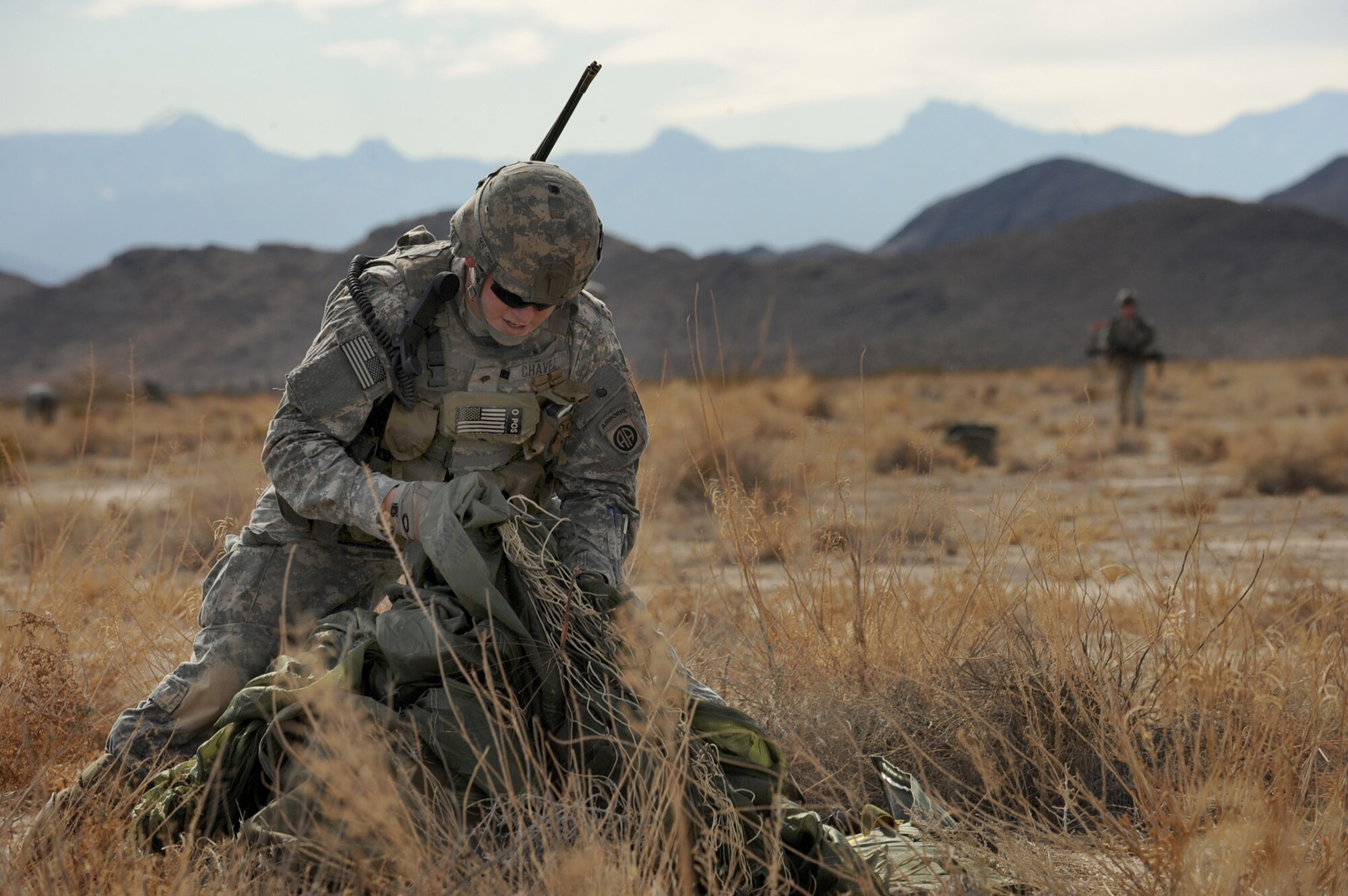 NEVADA TEST AND TRAINING RANGE -- Spc. Jonathan Chavez, 173 Calvary Airborne Reconnaissance Squadron, Fort Bragg, N.C., packs his parachute during a Mobility Air Forces Exercise, Nov. 18. The soldiers are part of the bi-annual U.S. Air Force Weapons School MAFEX which provides realistic training for combat Air Force, mobility Air Force, and U.S. Army personnel.  Approximately 40 C-17s and C-130s from Air Force bases around the United States flew approximately 400 Soldiers from Fort Bragg, N.C., for airdrops on the NTTR. In addition to providing airdrop training, the exercise also allows Soldiers the opportunity to utilize the range facilities to conduct urban ground operations training.
(U.S. Air Force photo by Airman 1st Class Jamie Nicley)